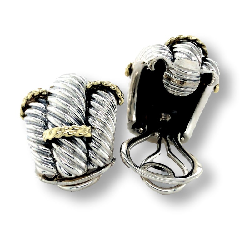David Yurman vintage earrings finely crafted in blackened sterling silver in a half-hoop and triple cable row design with yellow gold rope twist stations, completed with posts and large omega clip backs. Earrings are fully hallmarked with designer