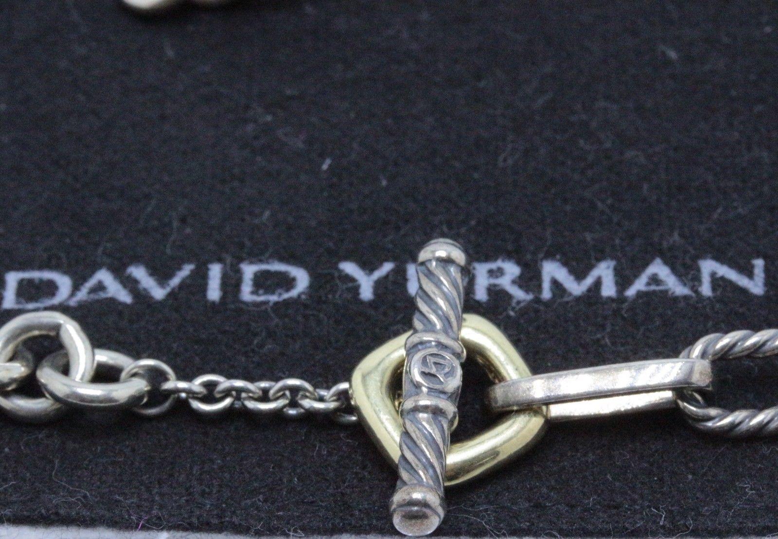 David Yurman 
Style:  Figaro Toggle Clasp Chain Necklace
Metal:  Sterling Silver & 18KT Yellow Gold
Length:  16' Inches
Hallmark: DY 750 925 
Includes:  Elegant Necklace Box