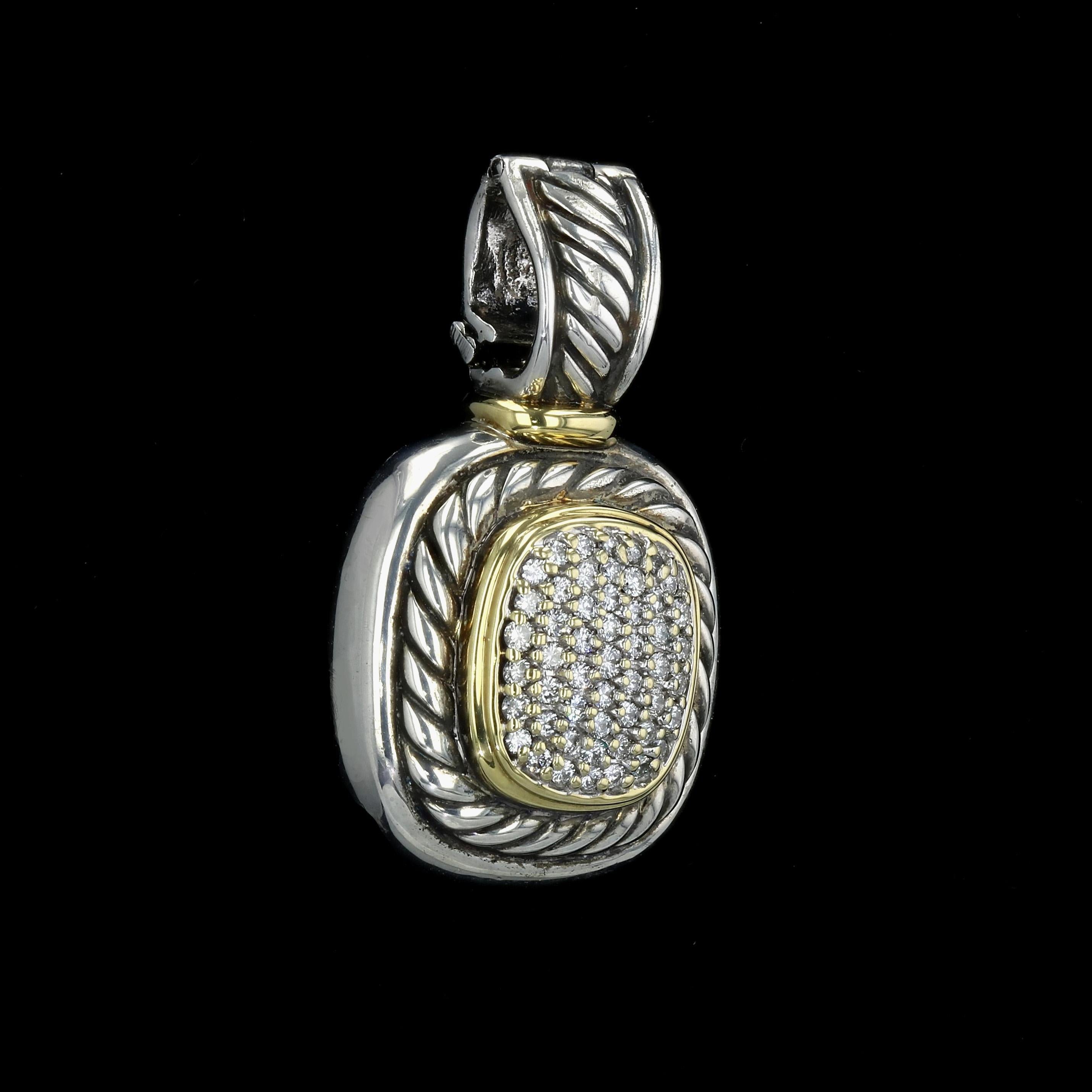 Estate sterling silver David Yurman pendant/necklace enhancer with 18K yellow gold accents. The piece is styled in the quintessential Yurman cable twist design and set with more than 50 round brilliant diamonds. The diamonds have average color of