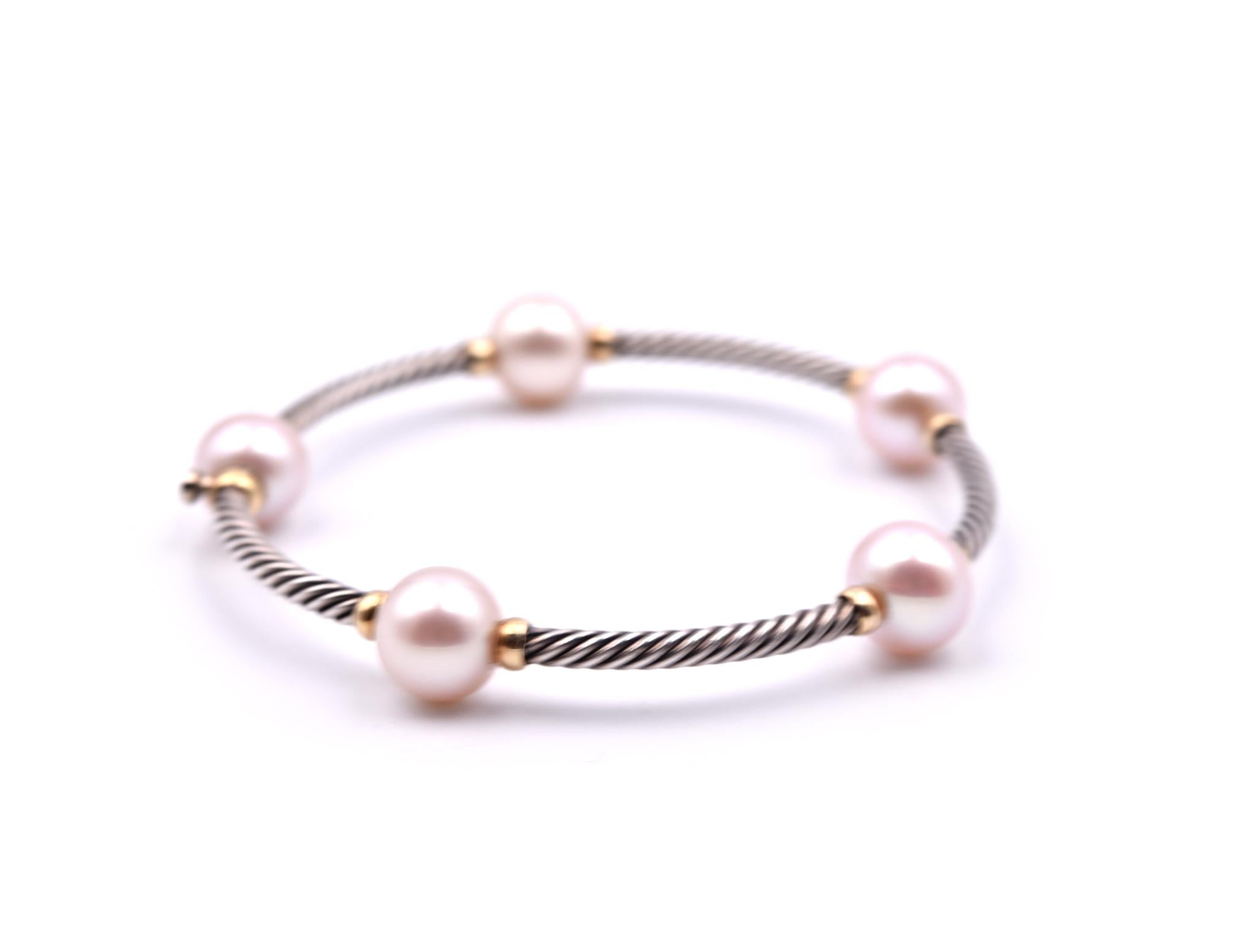 Designer: David Yurman
Material: sterling silver and 18k yellow gold
Dimensions: bangle will fit a 6 ½ inch wrist
Weight: 17.98 grams
