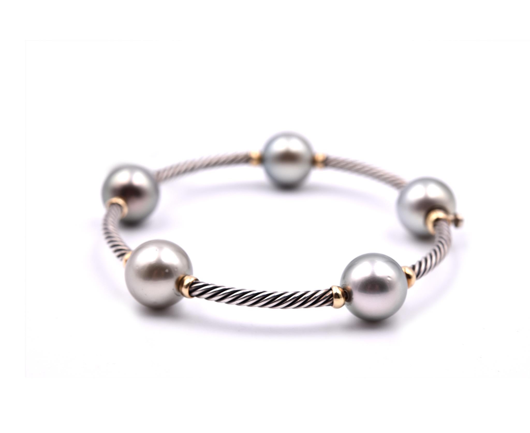 Designer: David Yurman
Material: sterling silver and 18k yellow gold
Dimensions: bangle will fit a 6 ½ inch wrist
Weight: 21.41 grams
