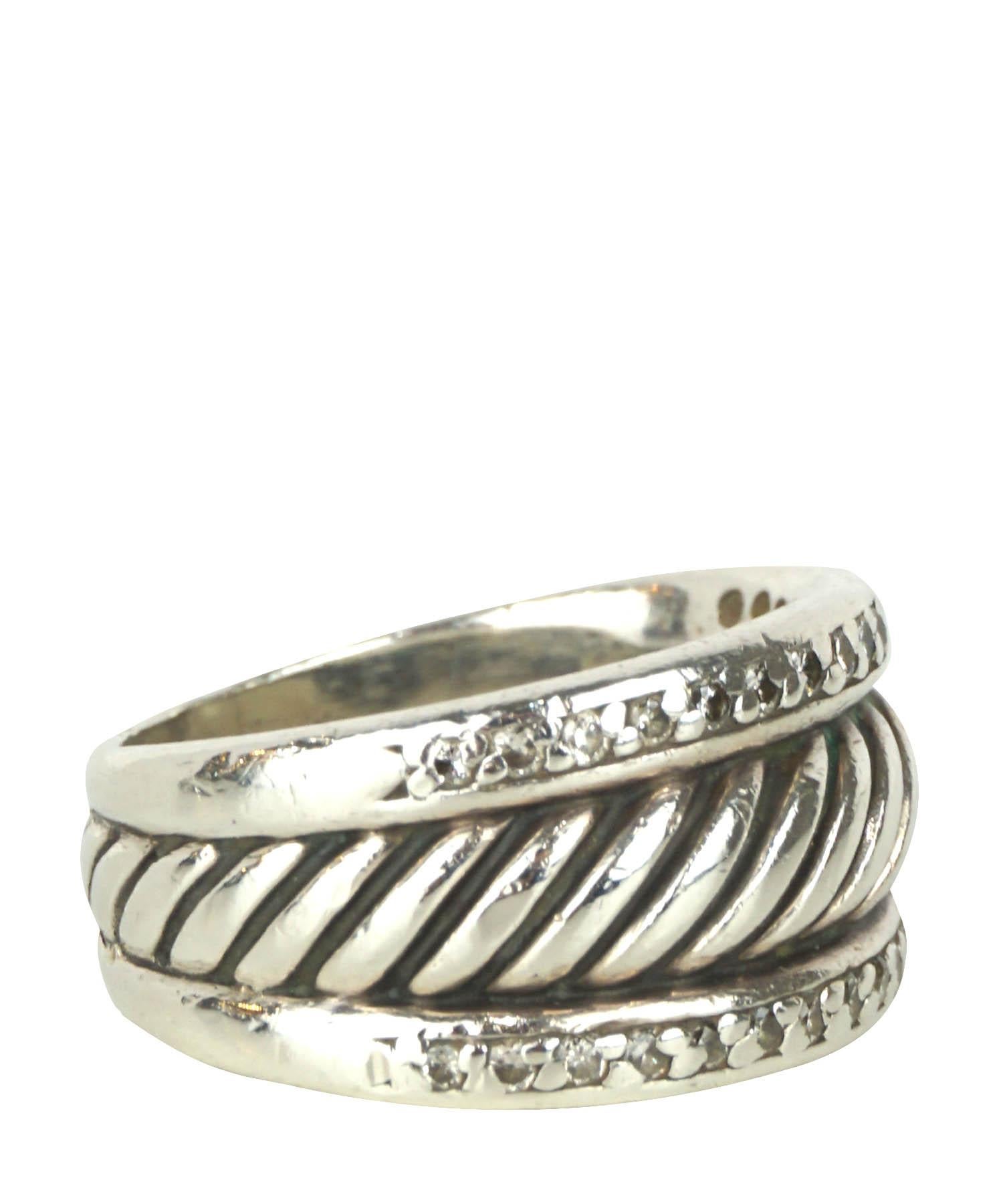 David Yurman cigar band ring features a thick sterling silver band with a cable wrapped center bordered by two rows of pave diamonds. US size 5. Made in New York, USA. Band Width: 3.8