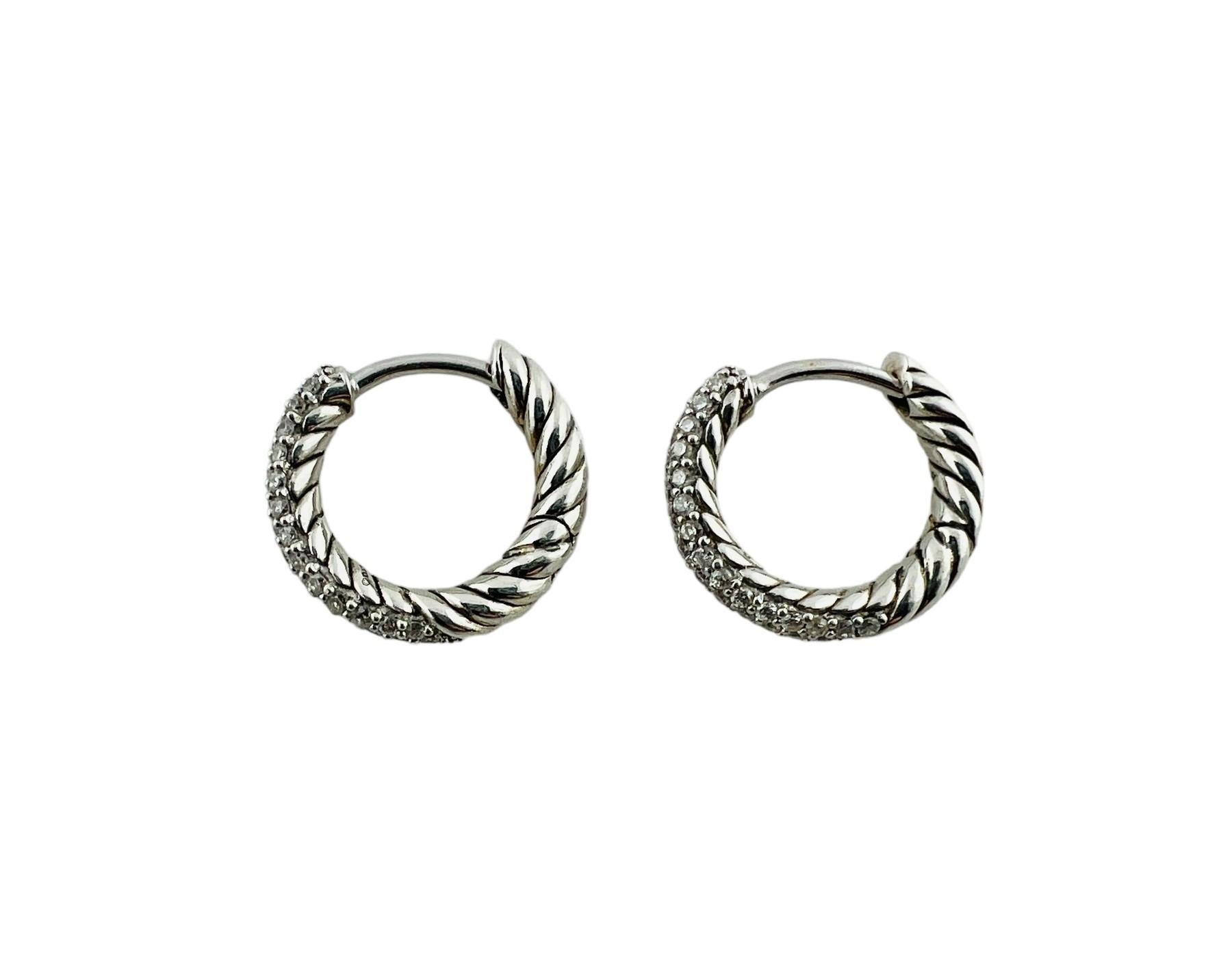 Vintage David Yurman Sterling Silver and Diamond Petite Pave Hoop Earrings-

These sparkling hinged hoop earrings by David Yurman are decorated with pave set diamonds in beautifully detailed sterling silver.

Total diamond weight:  .37 ct.

Size: 