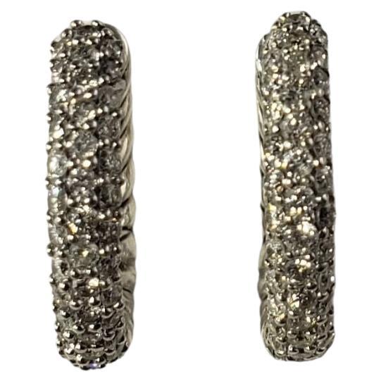 Vintage David Yurman Sterling Silver and Diamond Petite Pave Hoop Earrings-

These sparkling hinged hoop earrings by David Yurman are decorated with pave set diamonds in beautifully detailed sterling silver.

Total diamond weight: .37 ct.

Size: 15