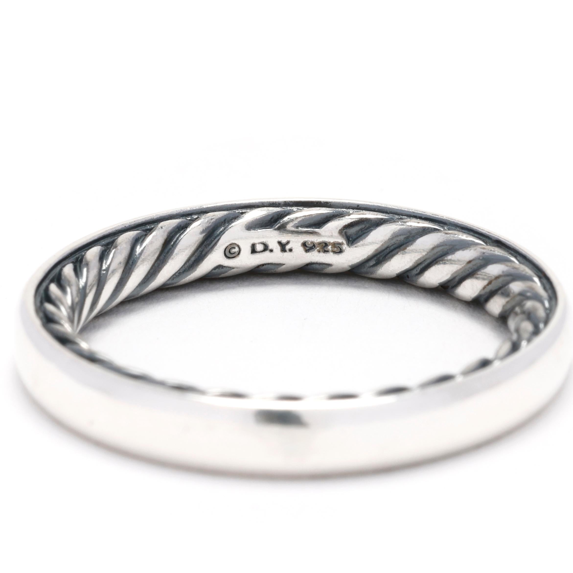 Embrace the timeless elegance and distinctive design of David Yurman with this stunning Sterling Silver Band Ring. Expertly crafted in high-quality sterling silver, this classic band ring features an inner twisted design that adds a unique and