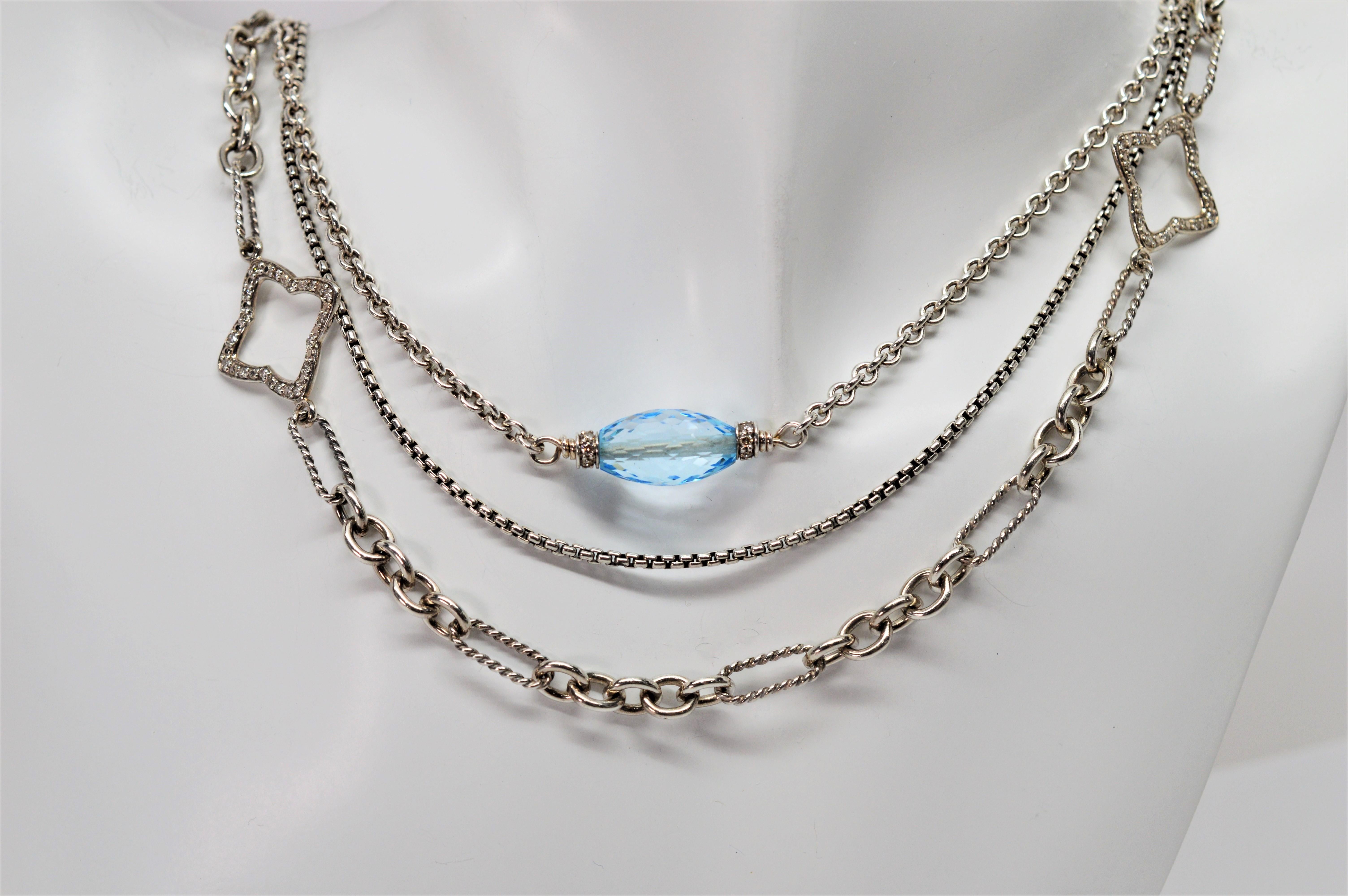 Intriguing piece by jewelry designer David Yurman. Three unique 32 inch sterling silver chains diverge to create this stunning multi strand necklace including cable chain with three Briolette cut blue topaz gemstones, a complimenting DY box chain