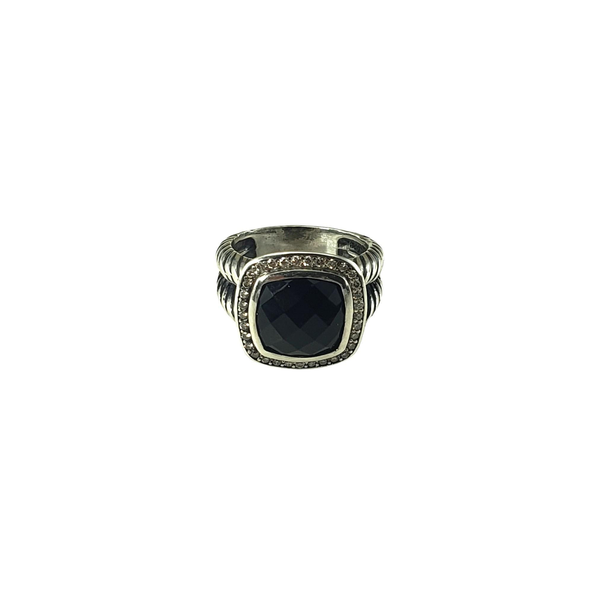 David Yurman Sterling Silver Black Onyx and Diamond Ring Size 6-

This elegant David Yurman ring features one faceted black onyx stone (11 mm x 11 mm) surrounded by 32 round brilliant cut diamonds and set in beautifully detailed sterling silver. 