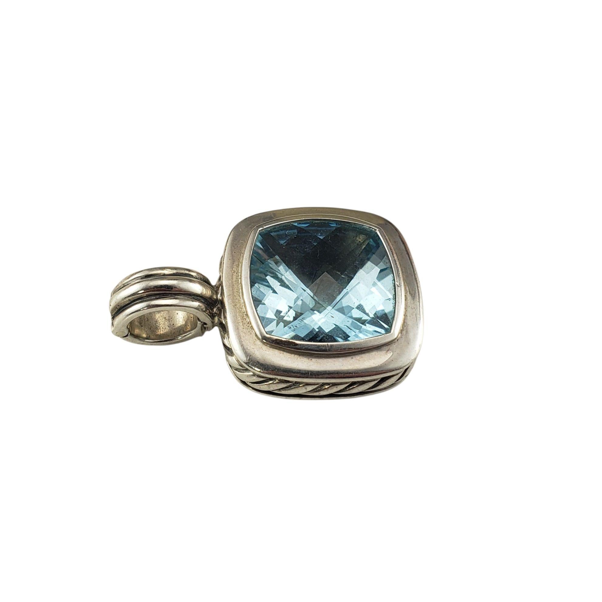 David Yurman Sterling Silver Blue Topaz Albion Pendant-

This striking Albion pendant features a richly faceted cushion cut blue topaz set in sterling silver, framed by Yurman's signature cable detailing. A timeless and versatile piece that will add