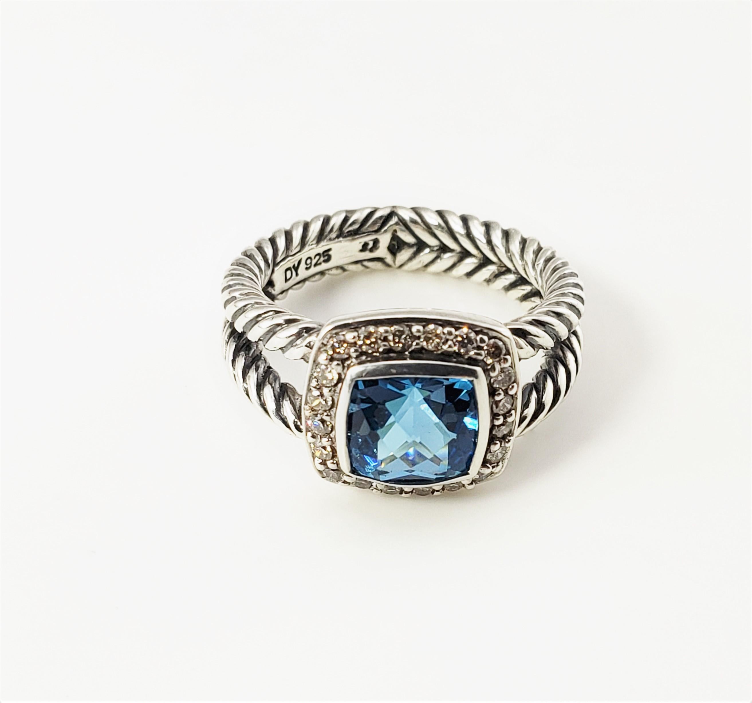 David Yurman Sterling Silver Blue Topaz and Diamond Ring Size 5.25-

This lovely David Yurman ring features one faceted blue topaz (7 mm x 7 mm) surrounded by 20 round brilliant cut diamonds set in beautifully detailed sterling silver.  Width:  11