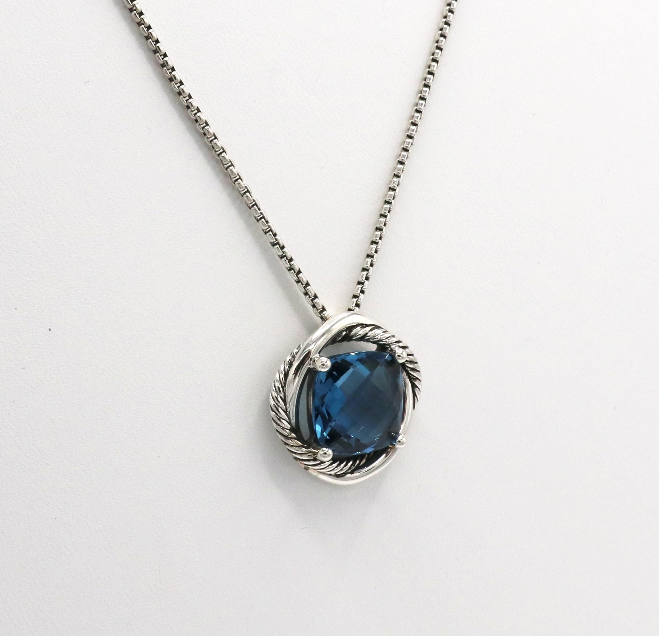 David Yurman Sterling Silver Blue Topaz Cable Infinity Pendant Necklace 
Metal: Sterling silver
Weight: 15.19 grams
Gemstone: Blue topaz, 13.5 x 13.5mm 
Pendant: 22 x 22mm
Chain: 18 inches, adjustable to 17 inches, 1mm wide
Signed: D.Y. 925
