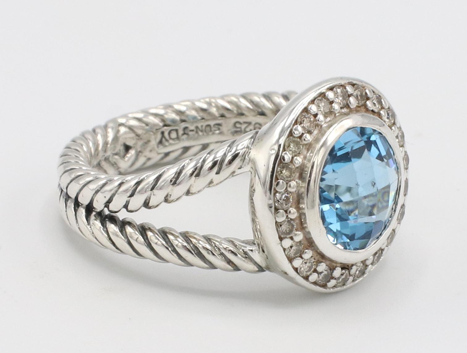 David Yurman Sterling Silver Blue Topaz & Natural Diamond Halo Ring 
Metal: Sterling silve 925
Weight: 6.66 grams
Diamonds: Approx. .23 CTW G-H VS round natural diamonds
Top: 13.5mm
Size: 6 (US)
