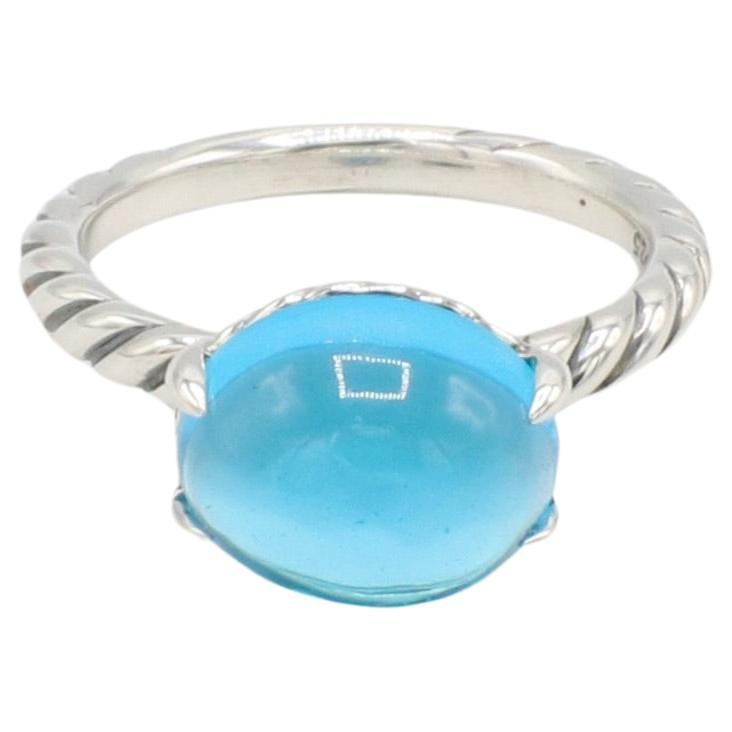 David Yurman Sterling Silver Cable Classic Blue Topaz Cabochon Dome Ring
Metal: Sterling silver
Weight: 4.65 grams
Topaz: Cabochon, 9.5 x 12 x 7mm
Size:  6.75 (US)
Signed: ©D.Y. 925
