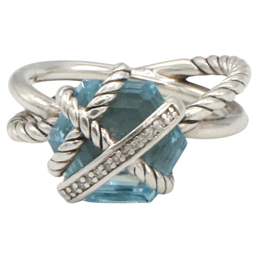 David Yurman Sterling Silver Cable Wrap Ring in with Blue Topaz & Natural Diamonds
Metal: Sterling silver
Weight: 5.11 grams
Diamonds: Approx. .03 CTW pave H-I VS round natural diamonds
Top: 11 x 11.5mm
Size: 6 (US)
Retail: $595 USD