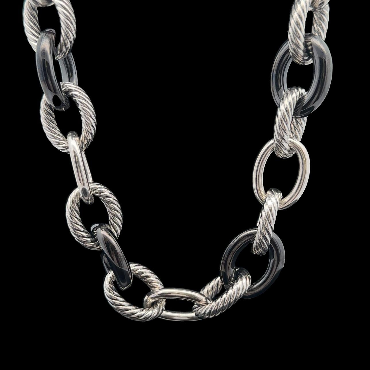Material: Sterling Silver .925 - Dark Grey Ceramic
Weight: 129.67 Grams
Chain Type: Large Cable link - Hidden Hinge Clasp
Chain Length: 17.5