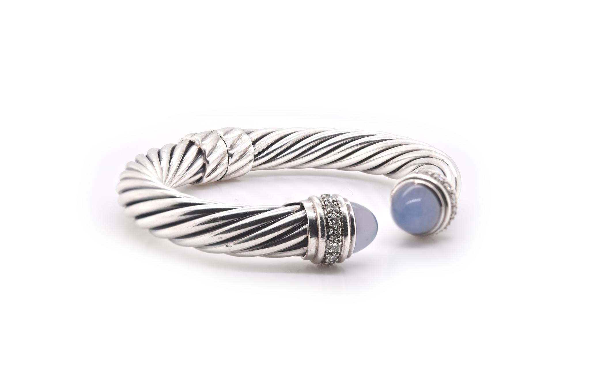 Designer: David Yurman 
Material: Sterling silver
Gemstone: 2 cabochon cut chalcedony 
Diamonds: 14 round brilliant cuts = 0.42cttw
Dimensions: bracelet measures 6.5” in length and 9.67mm in width
Weight: 41.92 grams
