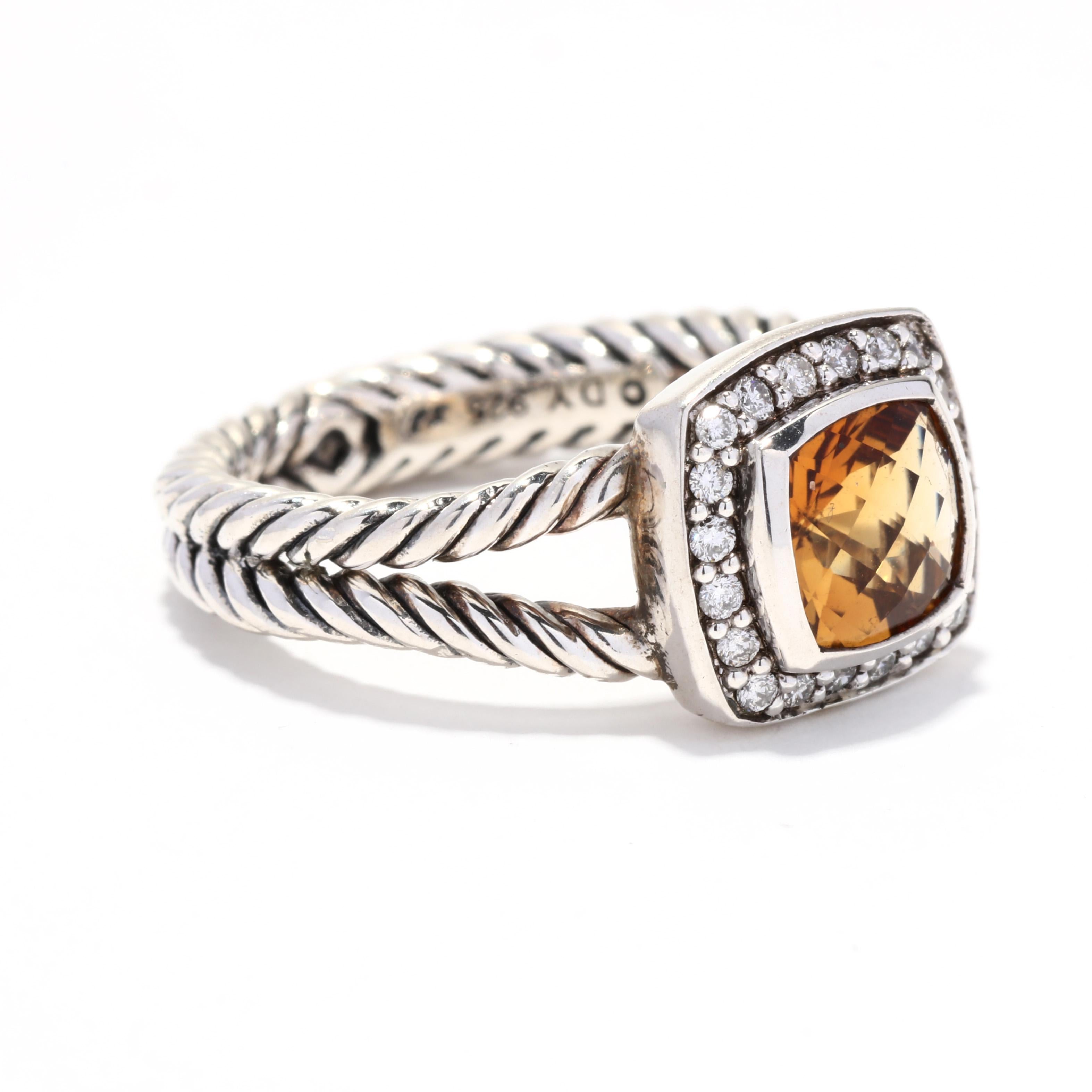 A vintage David Yurman sterling silver citrine and diamond albion ring. This November birthstone ring features a bezel set, cushion checkerboard citrine weighing approximately 1.45 carats surrounded by a halo of round brilliant cut diamonds weighing