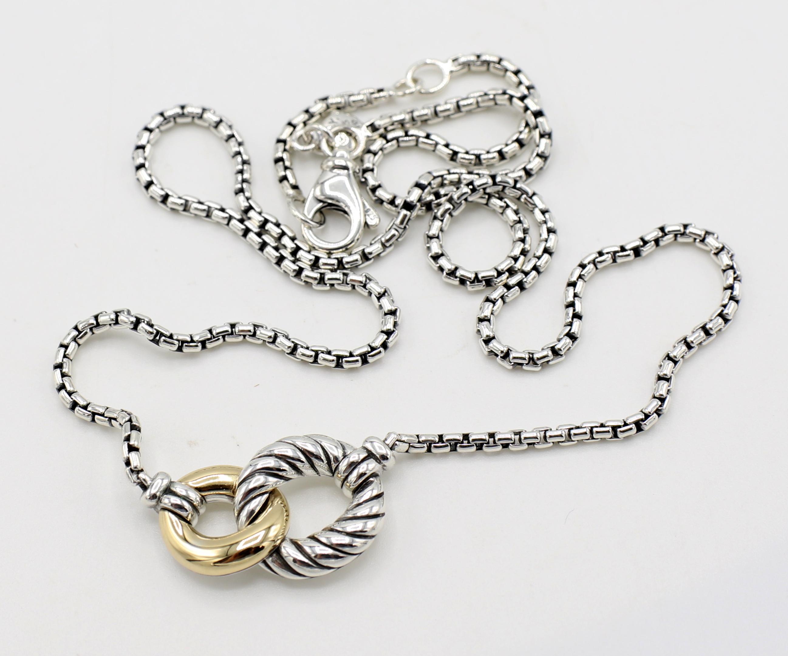 David Yurman Sterling Silver & 18 Karat Gold Belmont Curb Link Necklace 
Metal: Sterling silver & 18k yellow gold
Weight: 12.32 grams
Length: 17 inches, can be adjusted to 16 inches
Pendant: 21mm 
Chain: 2mm
Retail: $625 USD