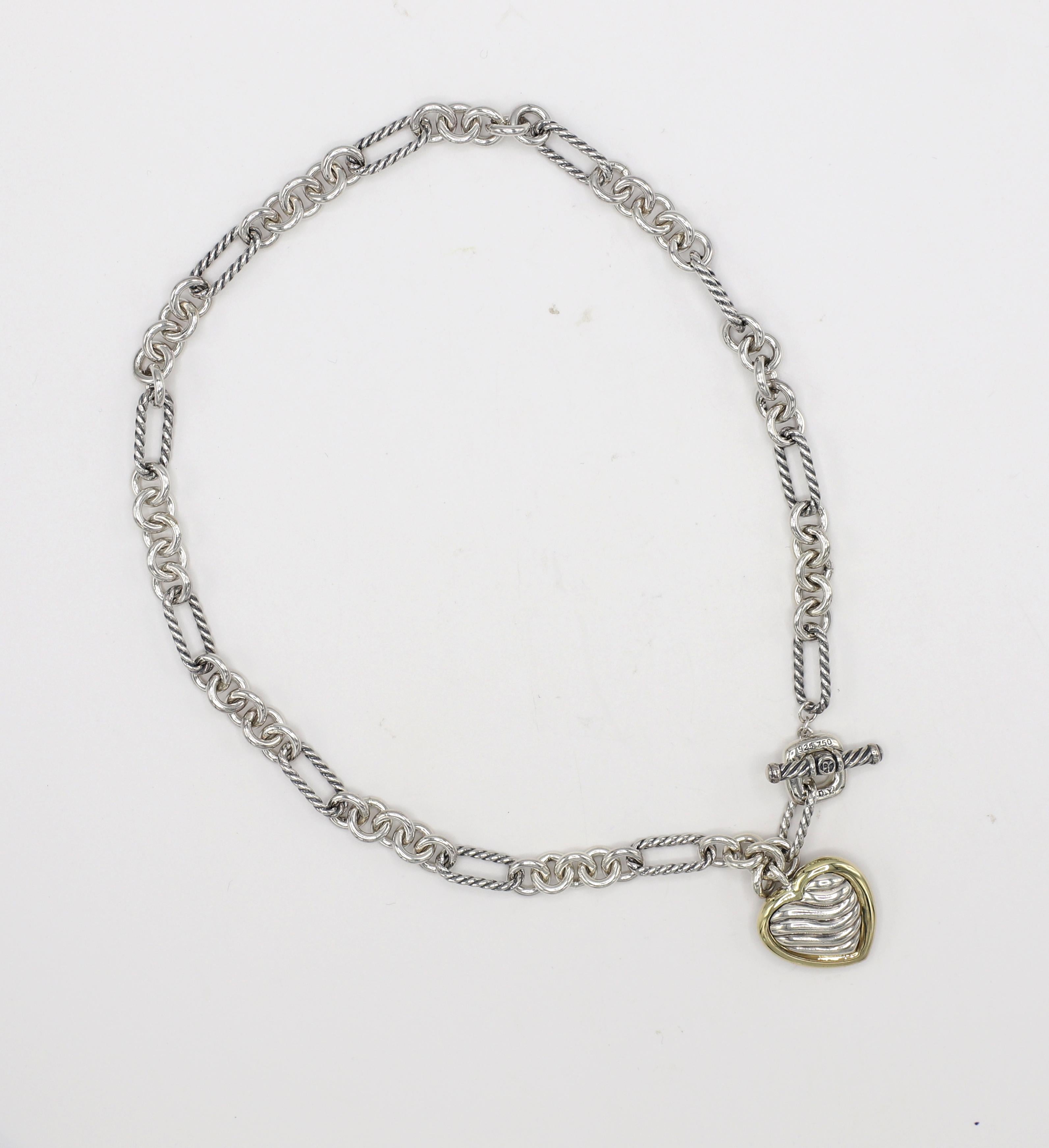 David Yurman Sterling Silver & Gold Cable Link Heart Charm Drop Necklace 
Metal: Sterling silver & 18k yellow gold
Weight: 45 grams
Heart: 20 x 20mm
Length: 16 inches
Clasp: Toggle

