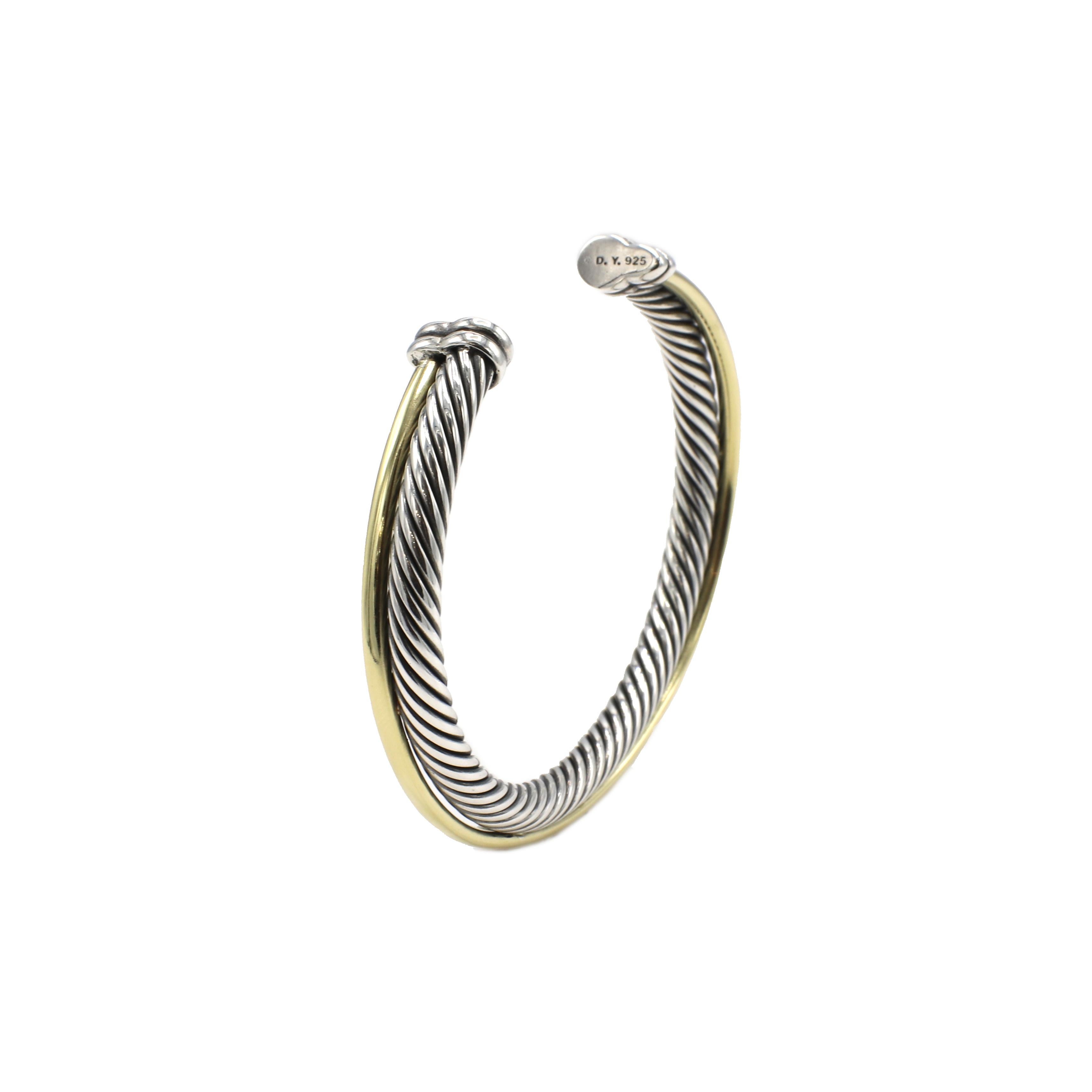 David Yurman Crossover Collection Sterling Silver & Gold Crossover Cable Bangle Bracelet 
Metal: Sterling silver & 18k yellow gold
Weight: 35.49 grams
Diameter: 60mm
Width: 5mm
Length: Fits a wrist approx. 6.75