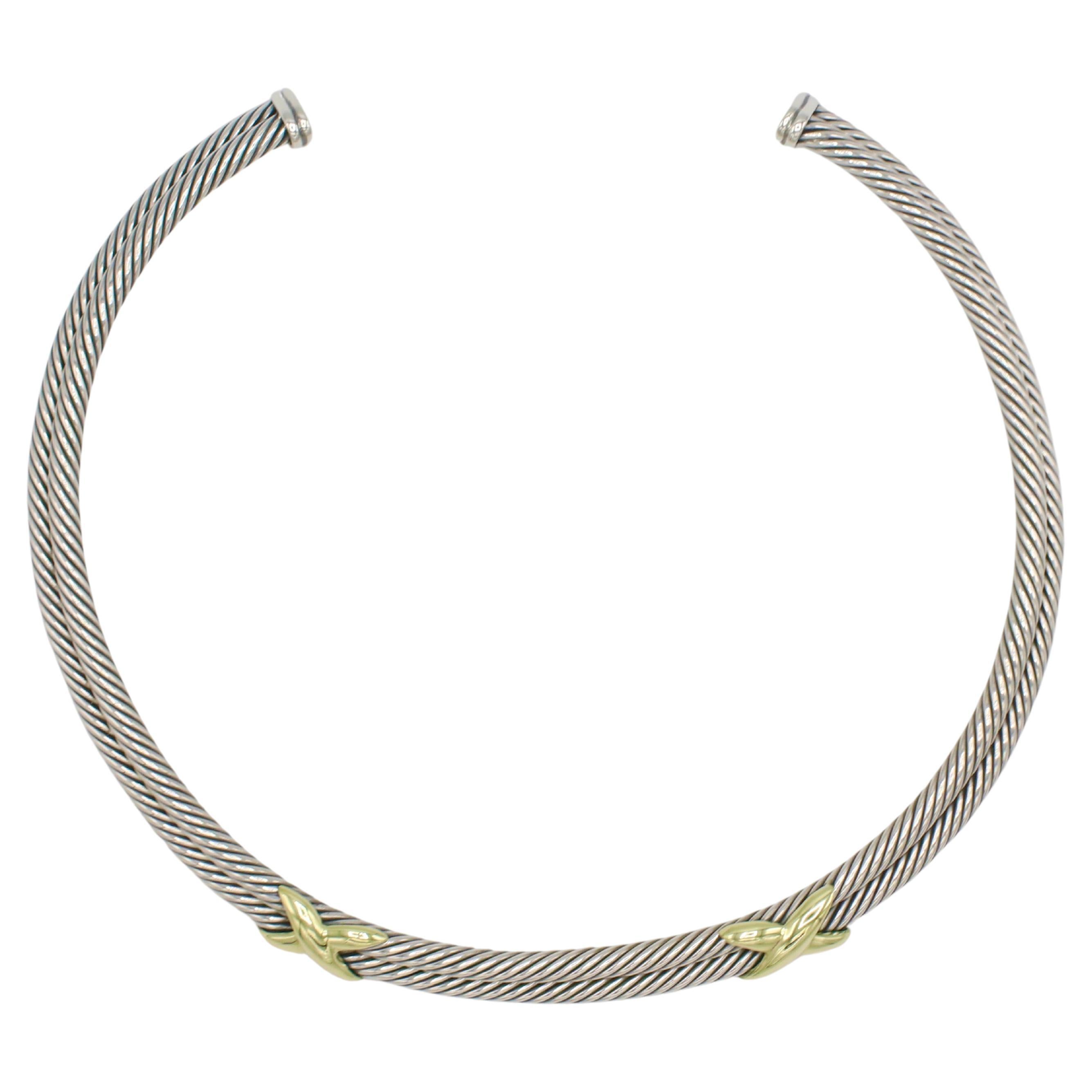 David Yurman - Collana a X con cavo a doppia fila in argento sterling e oro 
Metallo: Argento sterling e oro giallo 14 carati
Peso: 94 grammi
Larghezza: 10 mm
Lunghezza: Circa 15 pollici 
Firmato: ©D.YURMAN 14K 925
RNT I-15622
