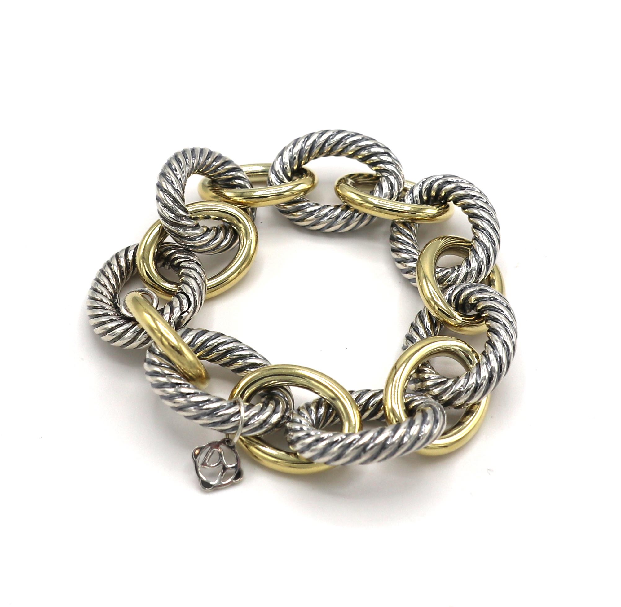 David Yurman Sterling Silver & Gold Oval Link Chain Bracelet 
Metal: Sterling silver & 18 karat yellow gold
Weight: 56.7 grams
Length: 8 inches
Silver links: 18 x 23mm
Gold links: 15 x 20mm
