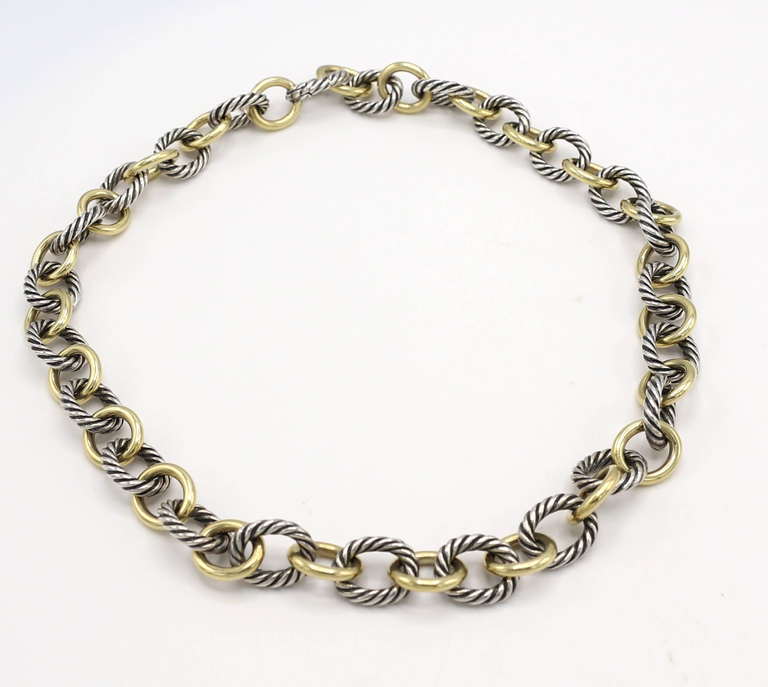 David Yurman Sterling Silver & Gold Two Tone Cable Oval Link Chain Necklace 
Metal: Sterling silver & 18 Karat yellow gold
Weight: 95.9 grams
Length: 18.5 inches
Gold links: 12 x 14mm
Silver links: 12.5 x 15mm