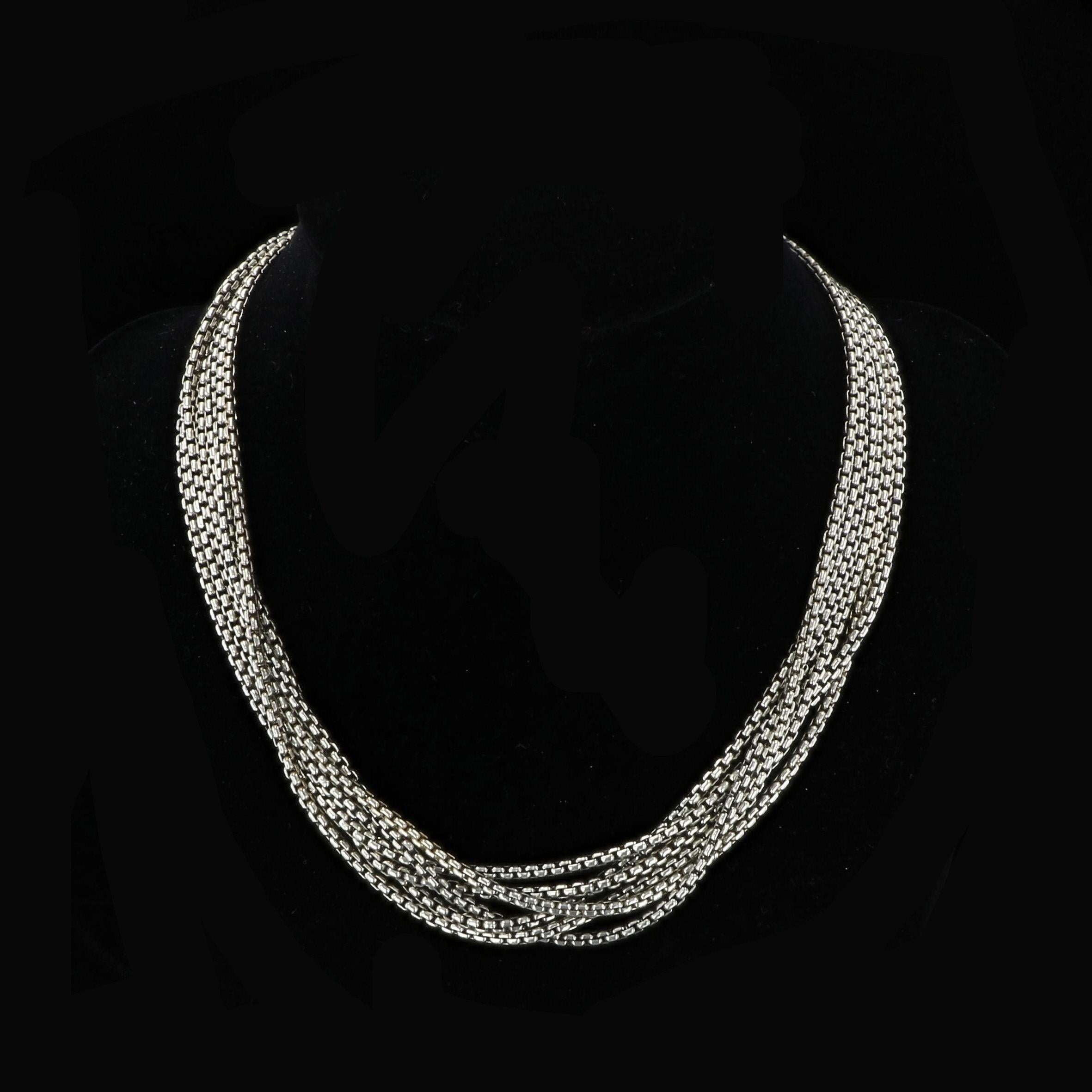 Classically chic sterling silver David Yurman necklace with 14k yellow gold accents at the clasp. The piece is comprised of a half-dozen sterling box chains that come together for a bold look. 17.5 inches in length.

Pendant shown sold separately;