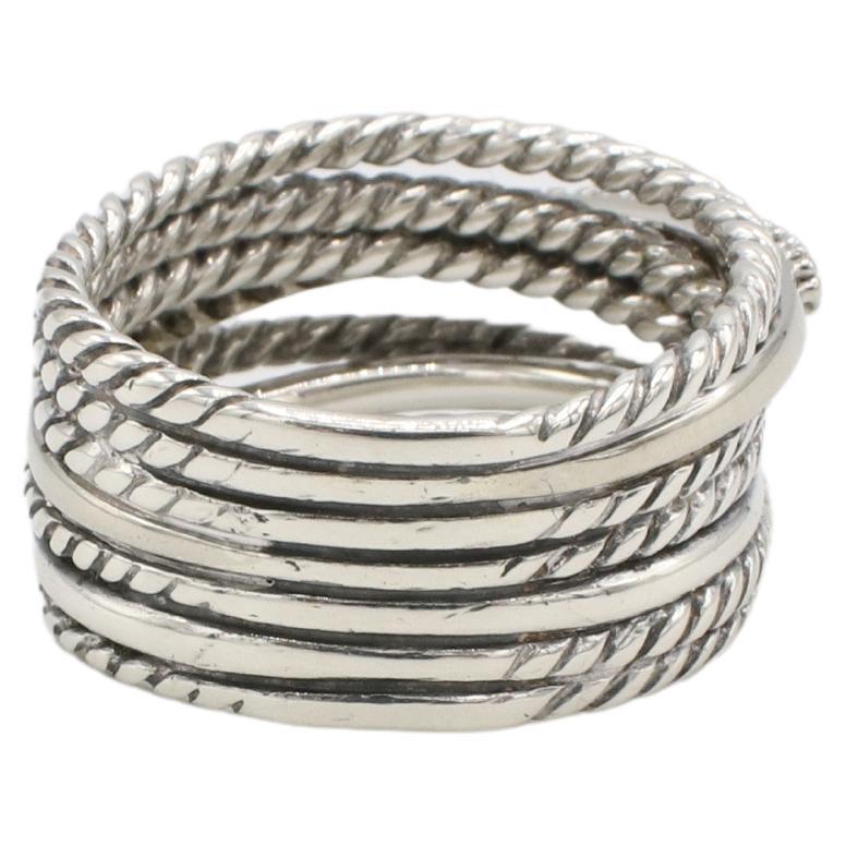 David Yurman Sterling Silver & Natural Diamond Crossover Multi-row Band Ring 
Metal: Sterling silver 925 and 14k gold
Weight: 7.44 grams
Size: 7 (US)
Signed: ©D.Y. 925 585
Width: 11mm
Diamonds: Approx. 0.18 CTW round natural diamonds G-H VS
Retail: