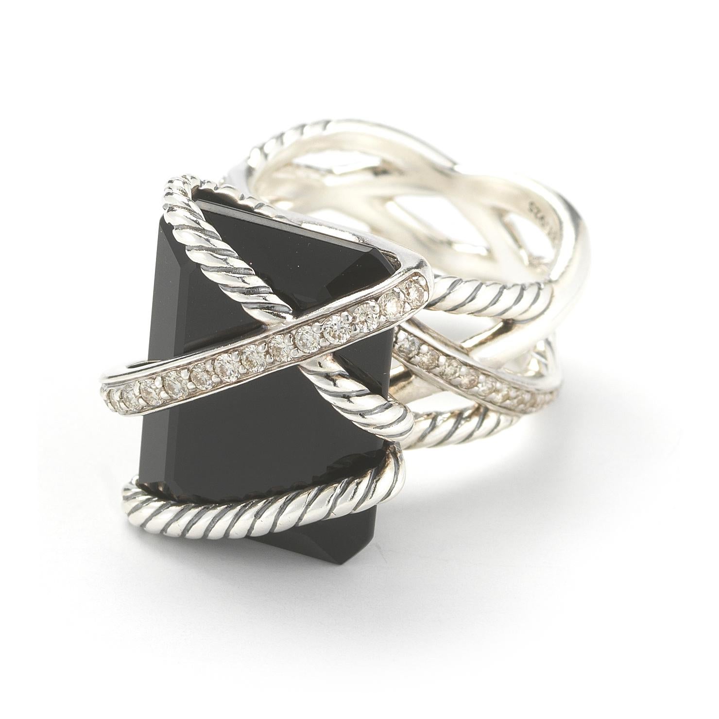 A David Yurman Cable Wrap cocktail ring featuring a 20 x 14.8mm emerald cut black onyx accented with silver wrap around details and a total of approximately 0.31 carats of round brilliant diamond accents mounted in sterling silver. Ring size 7.25