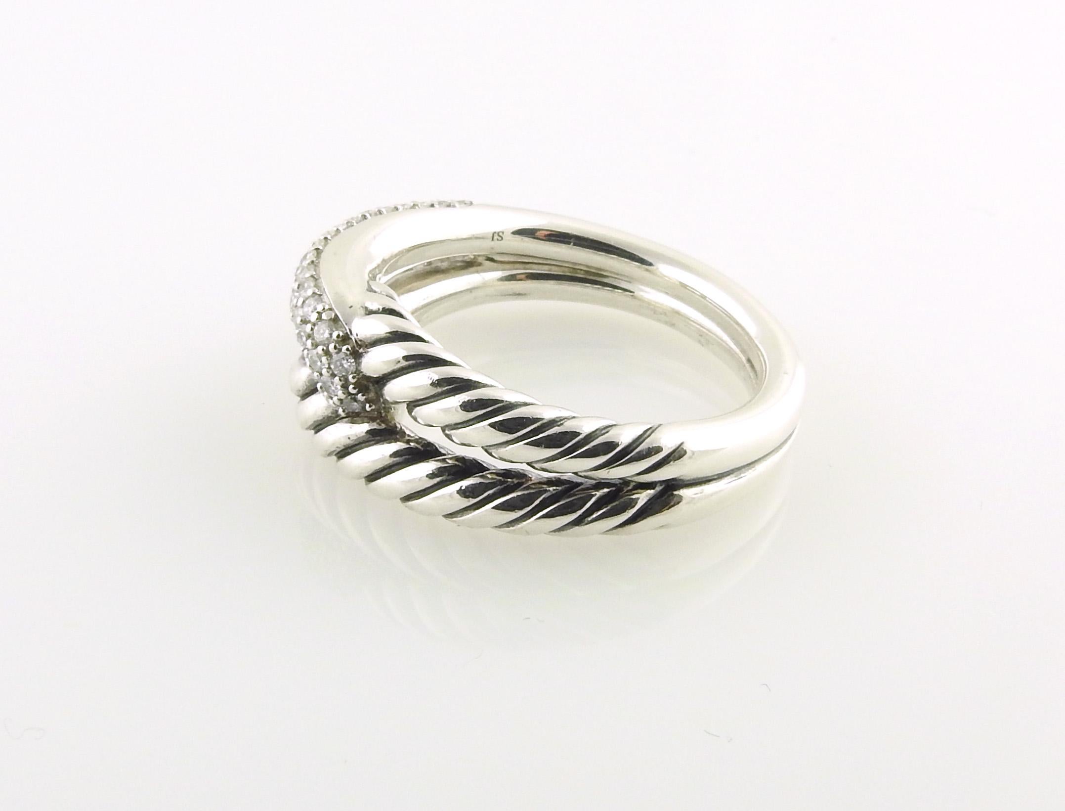 David Yurman Sterling Silver Diamond Labyrinth Ring

This beautiful single loop David Yurman labyrinth ring is set in sterling silver

1 cable band is interlocked with one pave diamond band.

Approx. .45cts in round pave diamonds.

Size 8

Front of