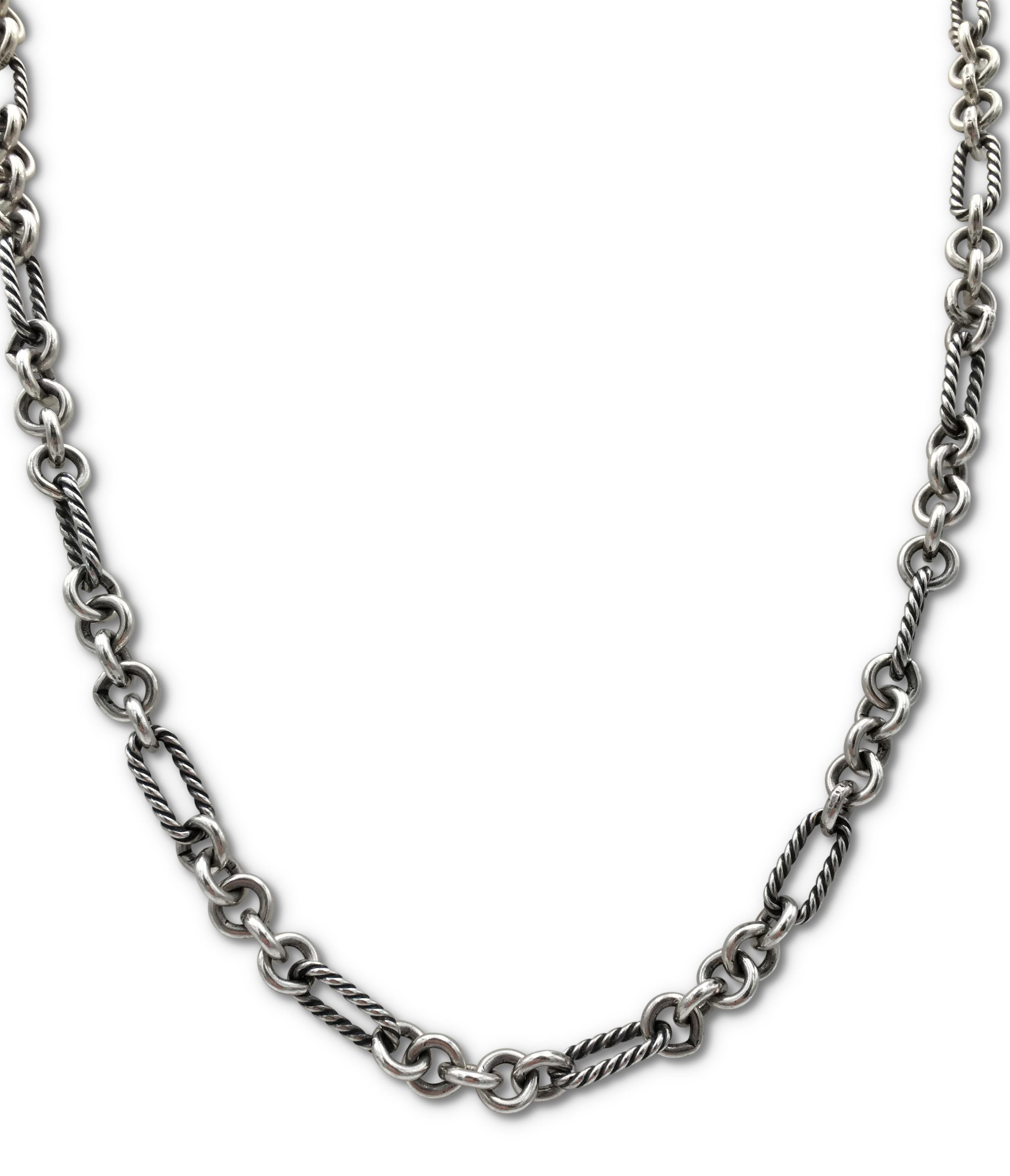 Authentic David Yurman petite Figaro necklace crafted in sterling silver and 18 karat yellow gold.  Featuring alternating round and cable-textured oval links, the necklace measures 33 inches in length.  The toggle clasp slides through a