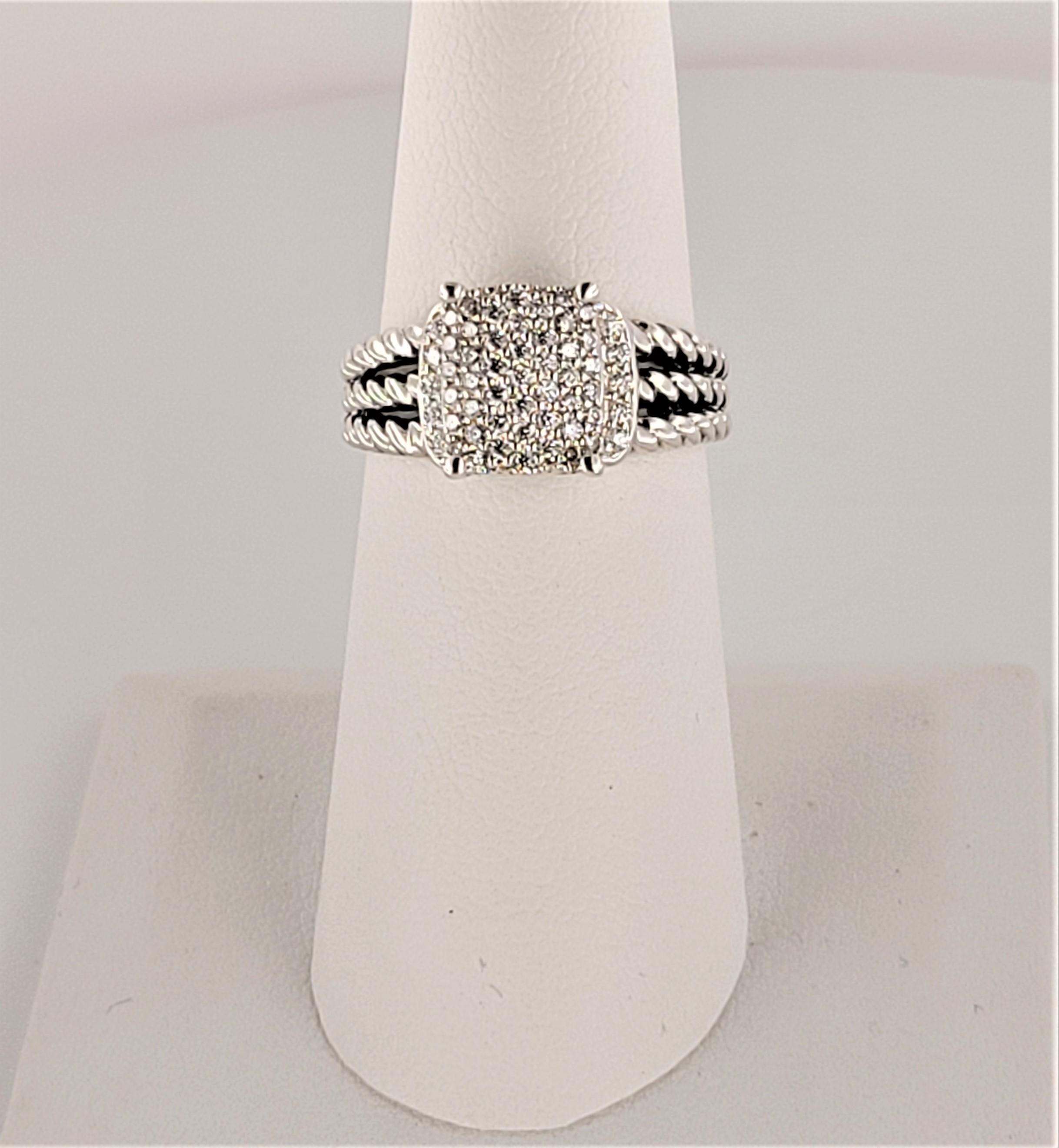 Brand David Yurman 
Gemstone Diamond 
Carat Weight 0.37ct
Stone Shape Round
Diamond Clarity SI 
Color Grade Near Colorless 
Material Sterling Silver 
Metal Purity 925
Ring Size 7
Ornament Length 9.6mm
Ornament Width 7.8mm
Ring Weight 5.5gr