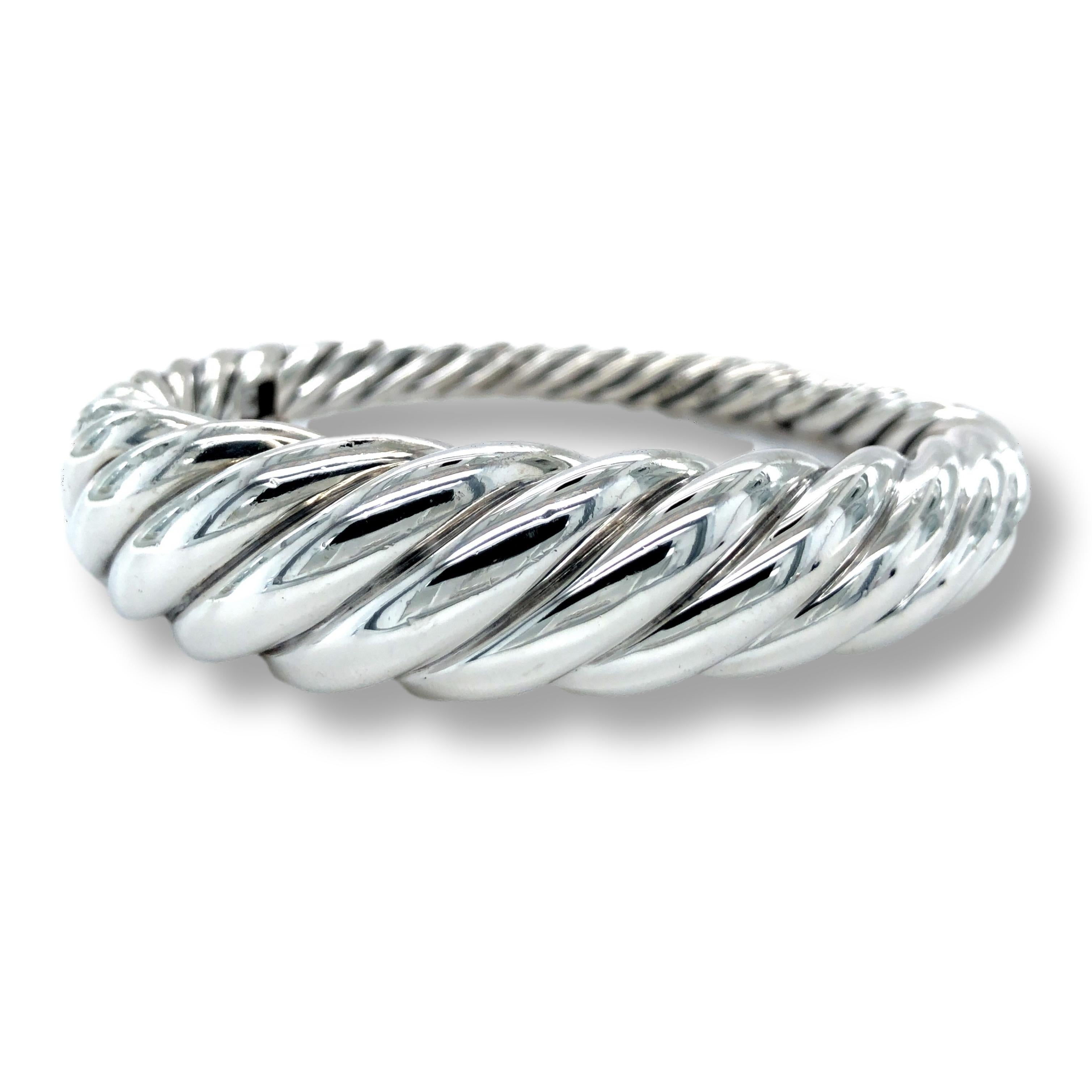 David Yurman pure form bangle bracelet finely crafted in sterling silver in a twist design measuring 17mm at the front and 6 mm towards the back. The bracelet has a snap hinge closure. 

BRACELET SPECIFICATIONS
Brand: David Yurman 
Hallmarks: © D.Y.
