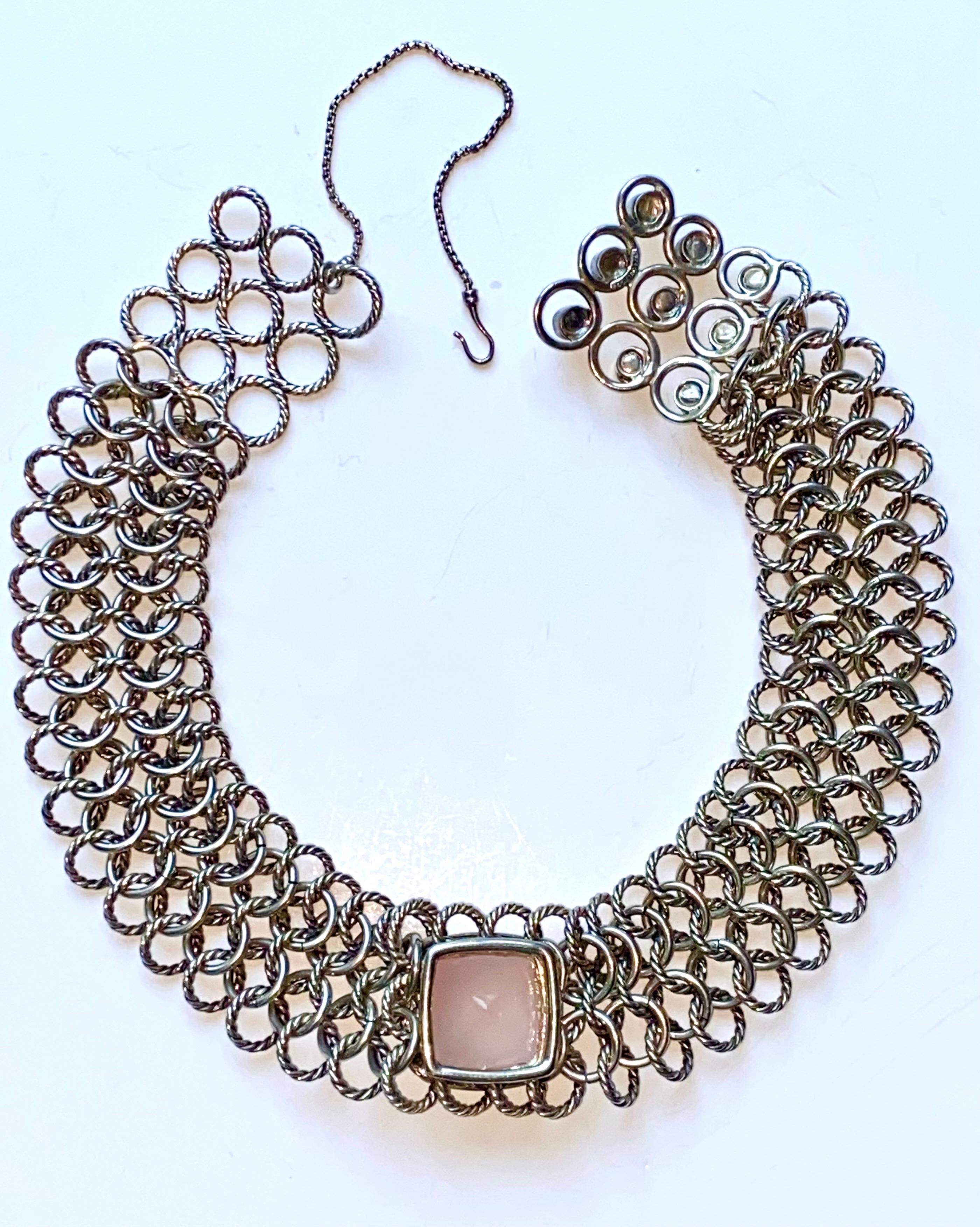 A stunning David Yurman Atlas sterling silver chocker necklace with rose quartz stone from the Albion collection. The Albion collections was first introduced in 1994 and has since become a classic design. The wide strand is comprised of five rows of