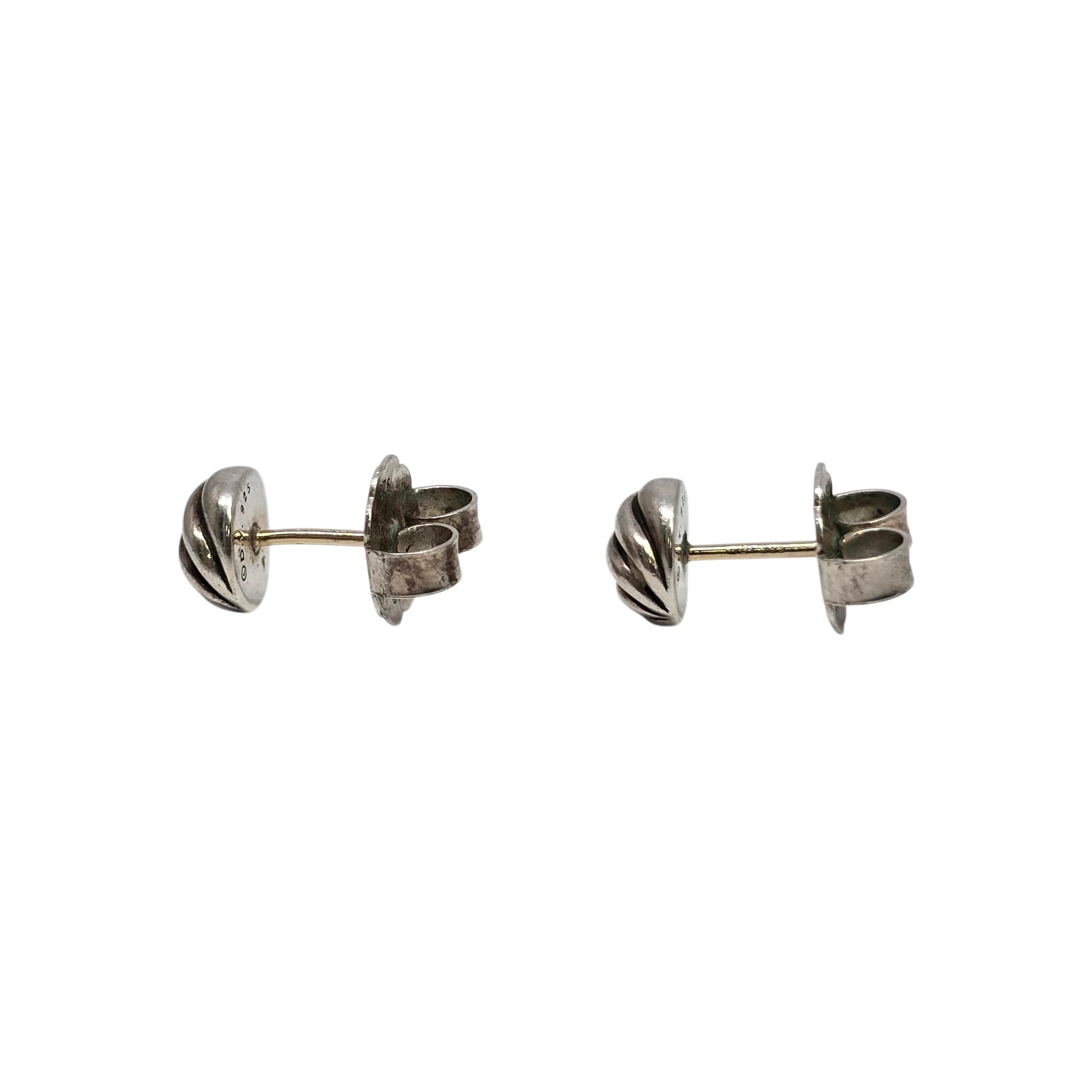 David Yurman Sterling Silver Sculpted Cable Stud Earrings 14K Gold Posts

A small pair of round stud earrings with a wavy cable design crafted in sterling silver with 14K gold posts.

Weighs approx 3.7g, 2.4dwt

Measures approx 8mm, 5/16