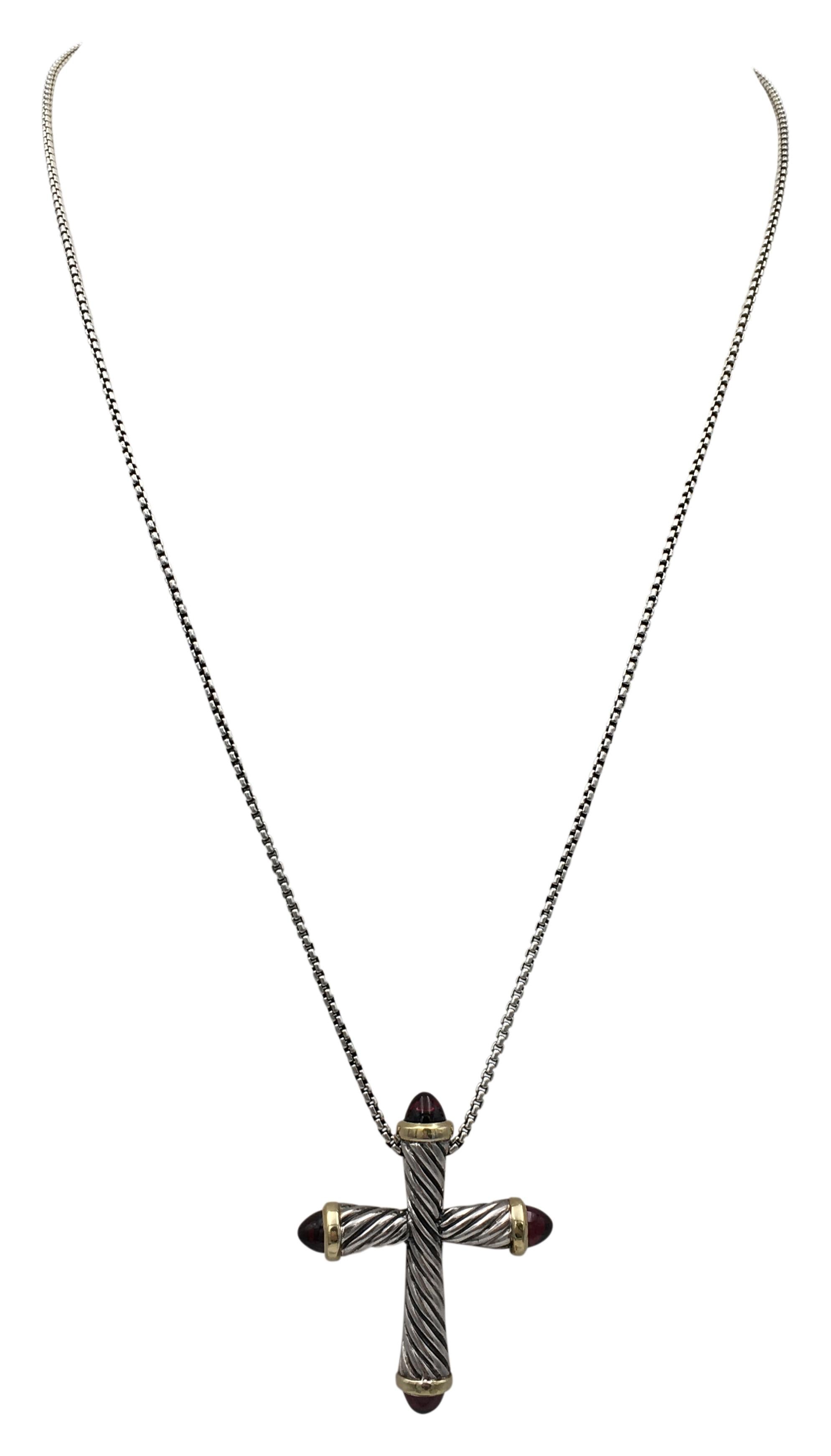 Authentic David Yurman Necklace crafted in sterling silver with 18 karat yellow gold.  A cross-shaped pendant measuring 43mm x 35mm with 4 garnet cabochon points hangs from a 24-inch sterling silver chain.  Signed DY, 925, 750.  CIRCA 2010s