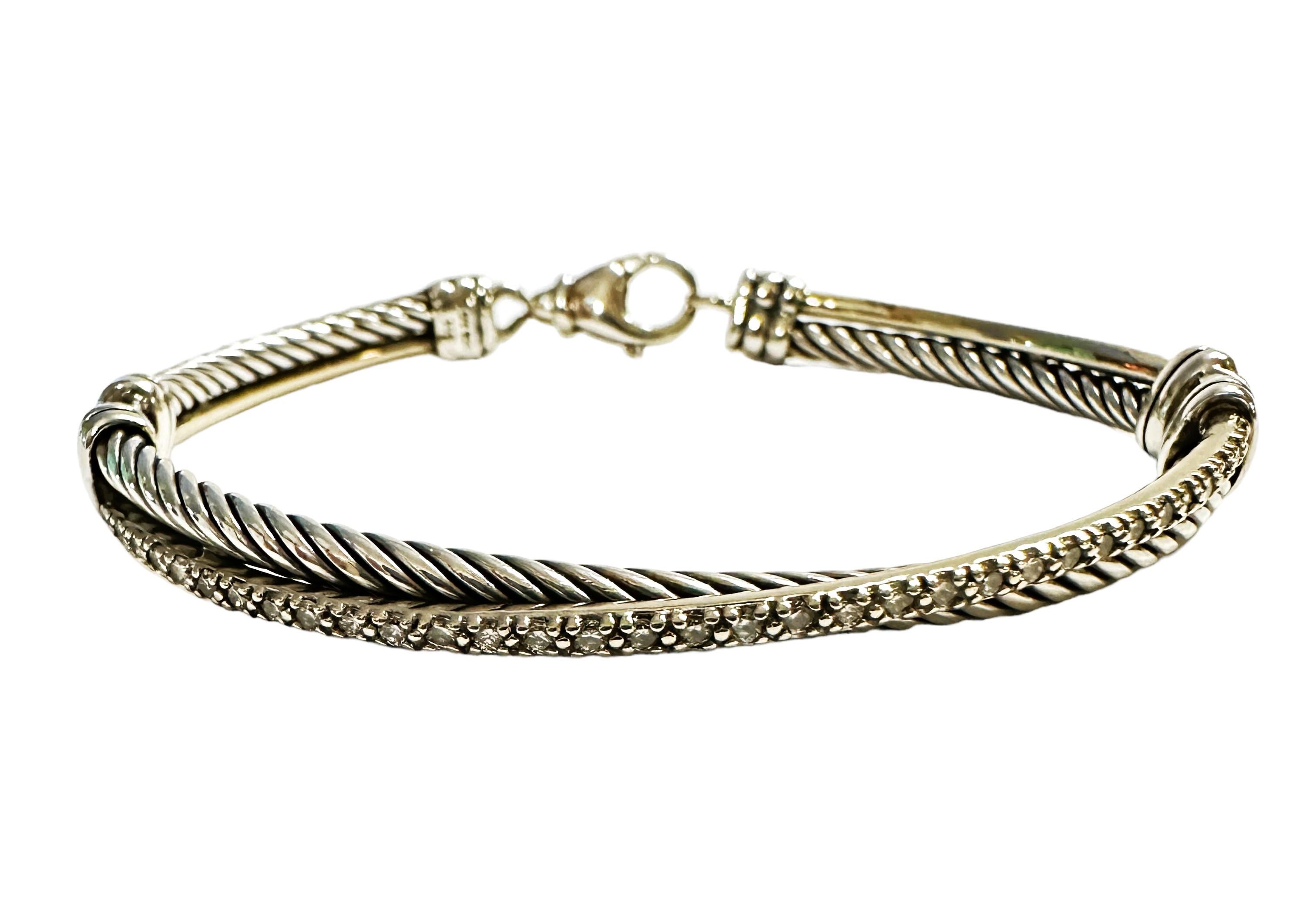 This is a fabulous bracelet by David Yurman.  He mixes 535 White Gold with 925 Sterling Silver to create this beautiful Crossover Bracelet with Pave Diamonds.  He uses a dynamic range of smooth and cabled cords, the individual strands are