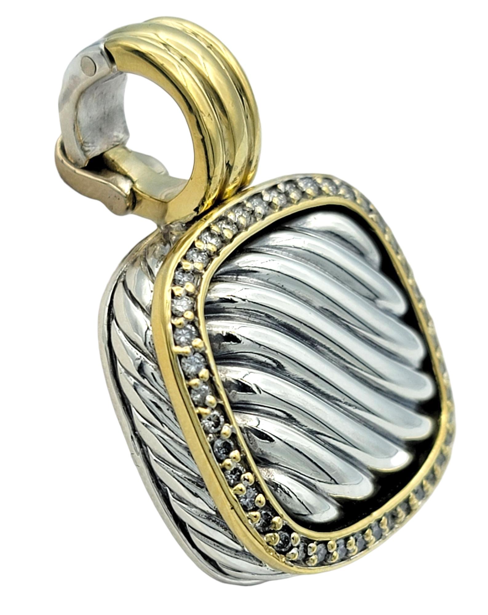 This authentic David Yurman Thoroughbred pendant enhancer showcases the brand's iconic cable motif framed in timeless elegance. The cushion-shaped pendant features a textured sterling silver center with a twisted rope design, encircled by a dazzling