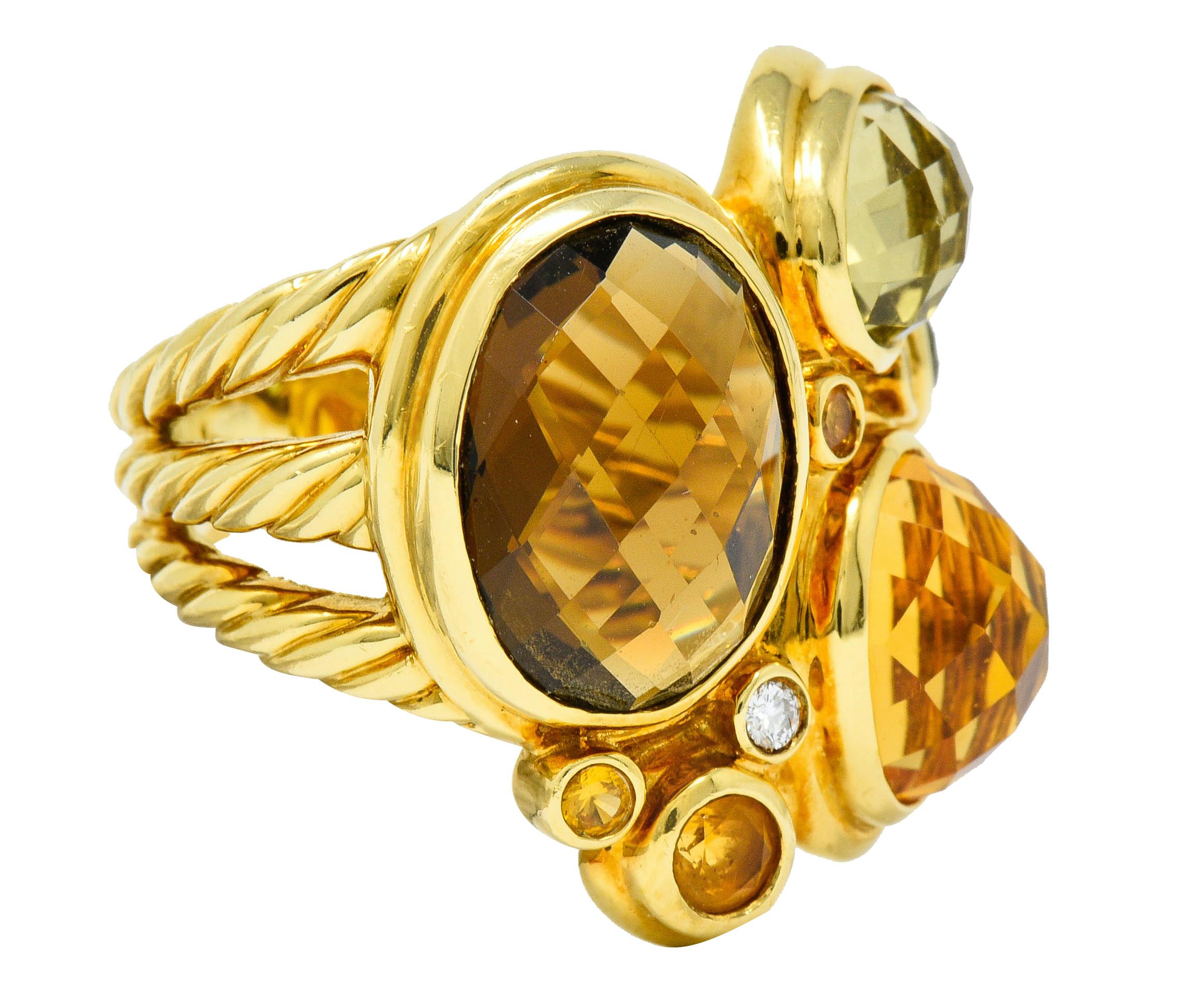 Ring is designed as an asymmetrical cluster of bezel set gemstones

Featuring smoky topaz, citrine, peridot, and others - transparent and fancifully faceted

Accented by round brilliant cut diamonds weighing approximately 0.08 carat; eye-clean and