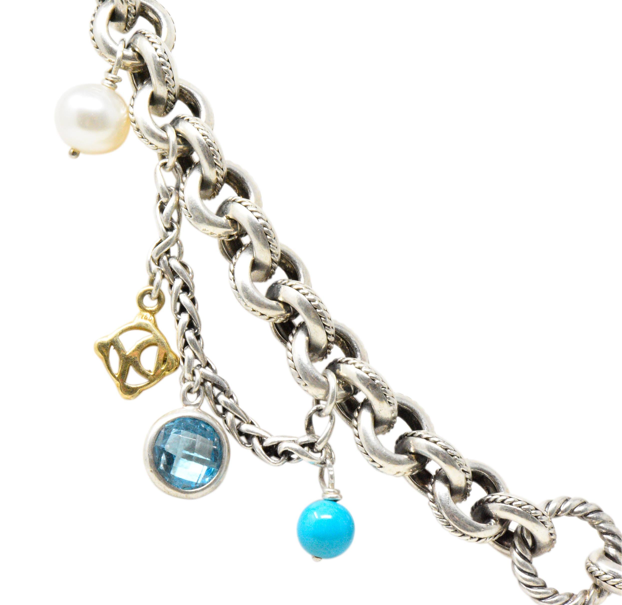 Featuring 7 faceted round blue topaz, 3 cultured pearls, 2 round turquoise beads and 3 David Yurman 18K yellow gold motifs 

High polished blackened twisted rope chain

Toggle clasp

Stamped 925, 750 and Signed D.Y. for David Yurman 

Measures: 18
