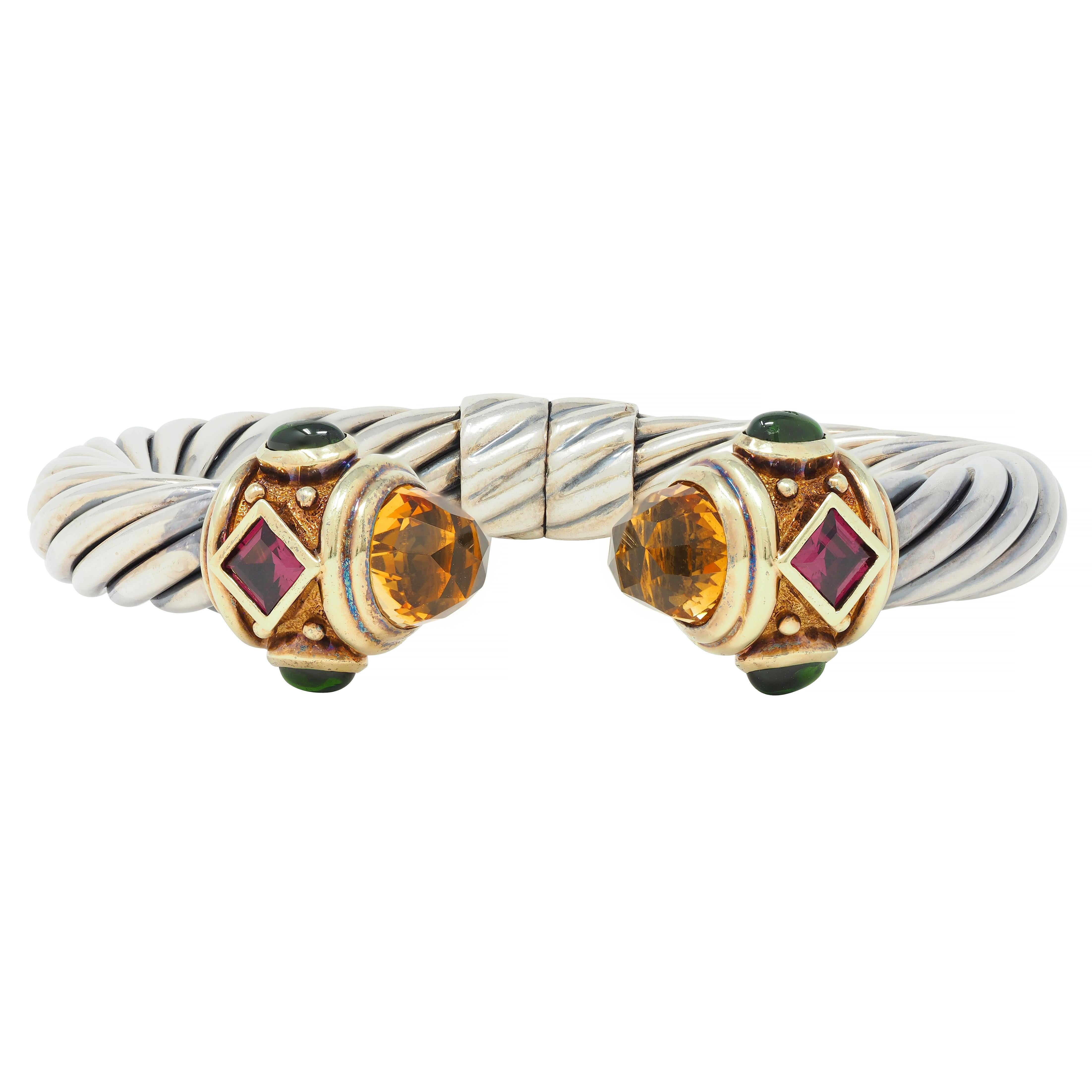 Open cuff is comprised of deeply grooved twisted cable motif silver with yellow gold terminals
Deeply ridged and completed by 9.5 mm round rose cut citrine bullet cabochons 
Transparent brownish orange in color with subtle zoning - bezel set