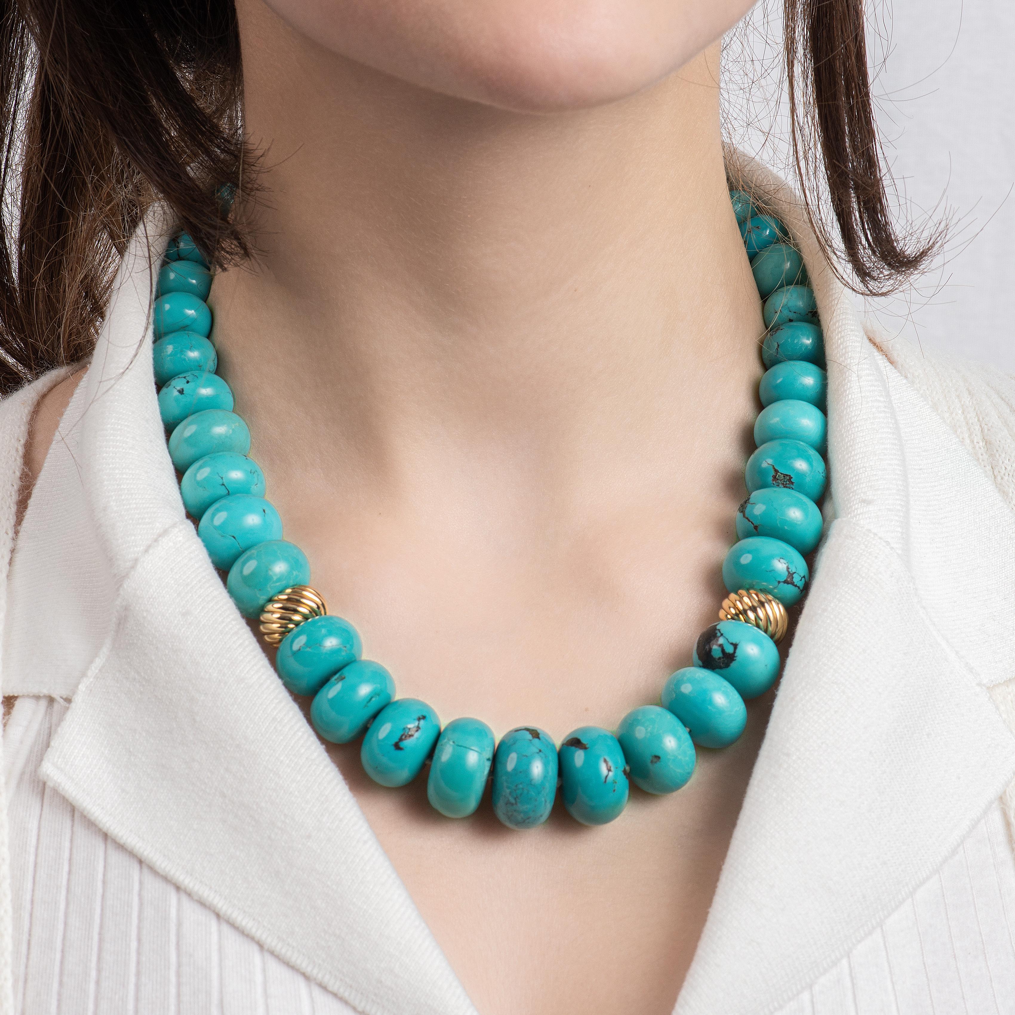 This incredible David Yurman Turquoise bead necklace features 41 turquoise beads, with 2 18kt yellow gold enhancers in the middle and a beautiful gold clasp. This piece is perfect for lovers of bold, chunky jewelry. It is approximately 18 inches