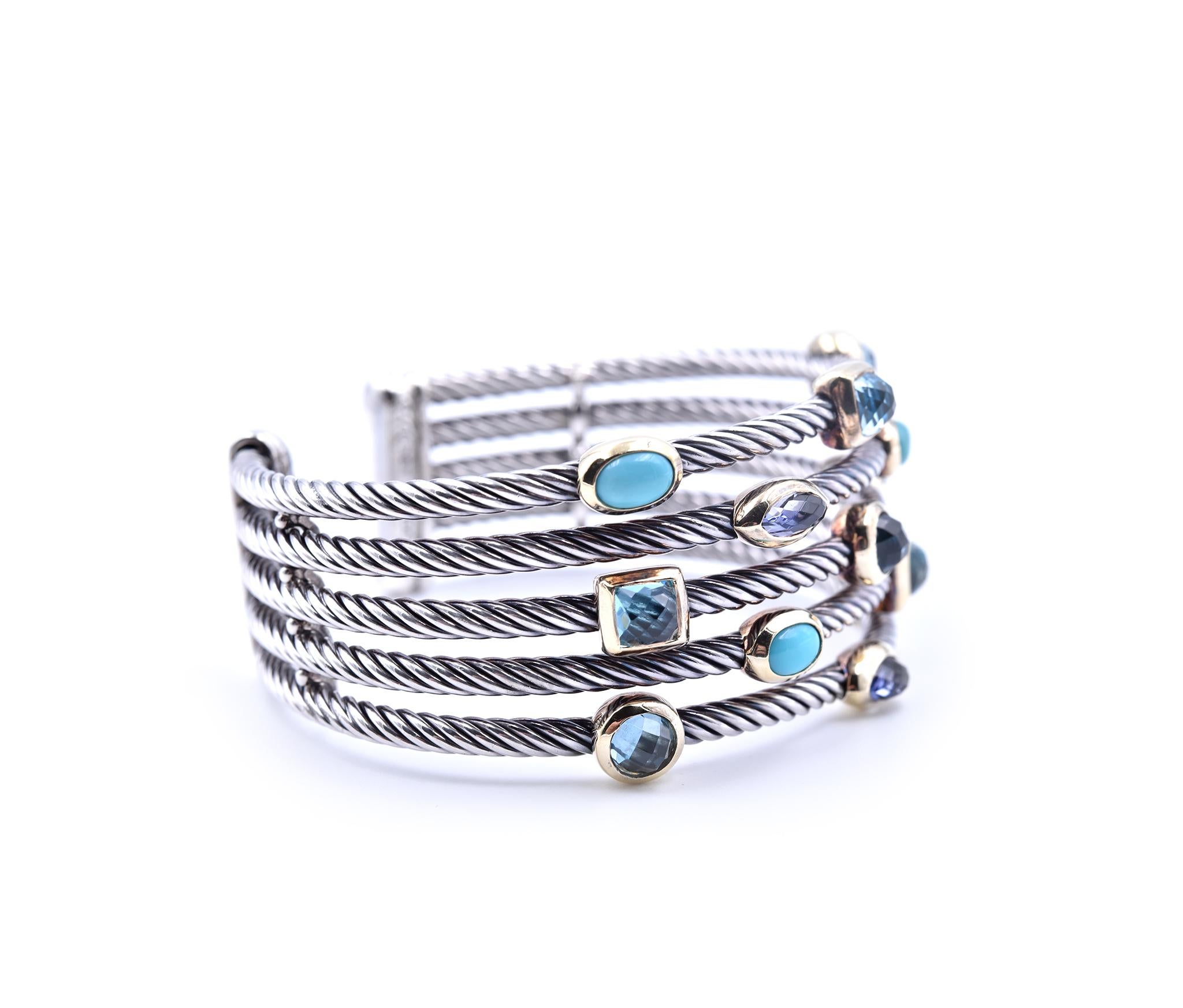 Designer: David Yurman
Material: sterling silver and 18k yellow gold bezels
Gemstones: 4 oval cabochon turquoise, 3 marquise cut iolite, 3 square checkerboard cut and 3 round checkerboard cut blue topaz
Dimensions: the bracelet measures 6 ½ inches