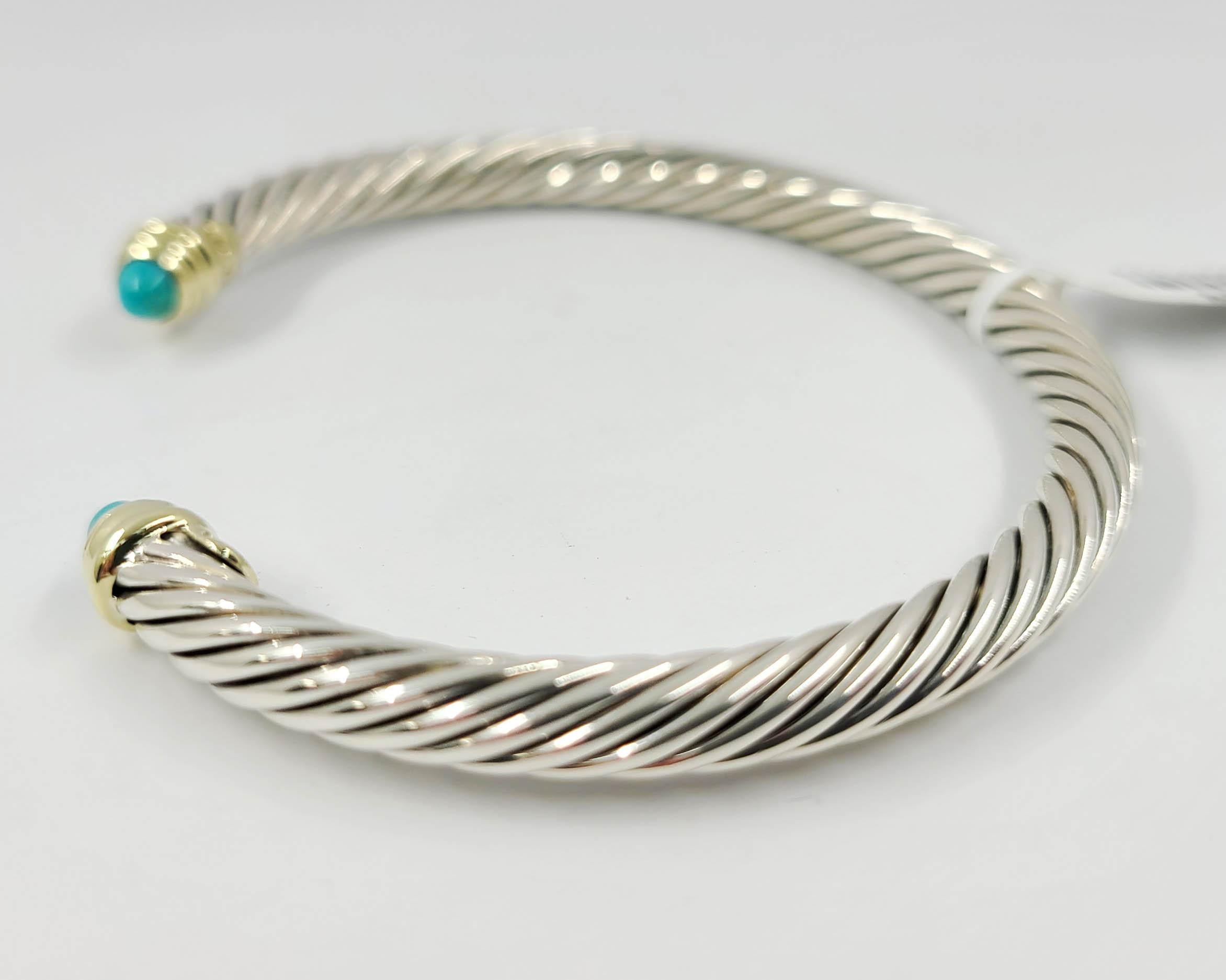 Estate David Yurman 5mm Cable Cuff in Sterling Silver with 14 Karat Yellow Gold Accents & Cabochon Turquoise End Caps. Original MSRP $650.