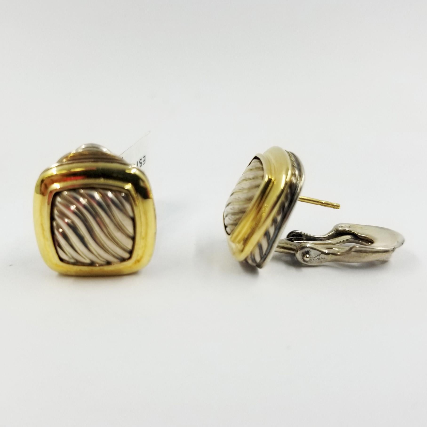 David Yurman Two Tone Albion Stud Earrings crafted in 18 Yellow Gold & Sterling Silver. Supportive Omega clip backs with post. Cable design. Original MSRP approximately $995.
