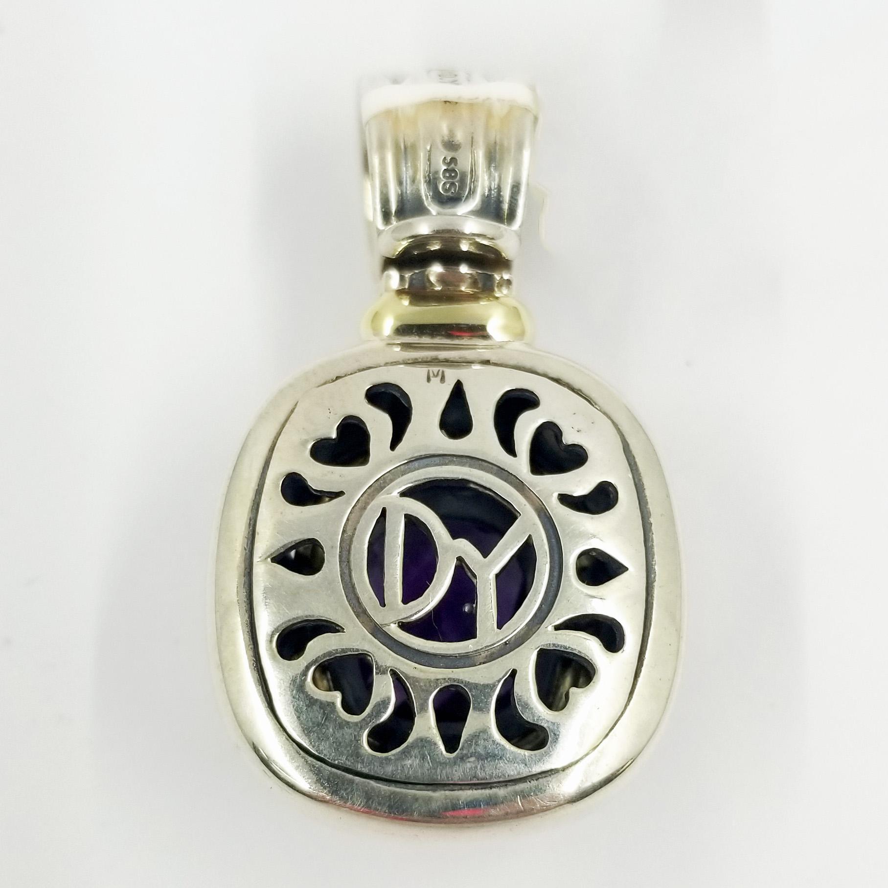 Amethyst Quartz Pendant from David Yurman set in 14 karat yellow gold and sterling silver. The enhancer features a bale that opens to locks onto various chains. The cushion-cut center stone is bezel set and measures approximately 10mm x 12mm.