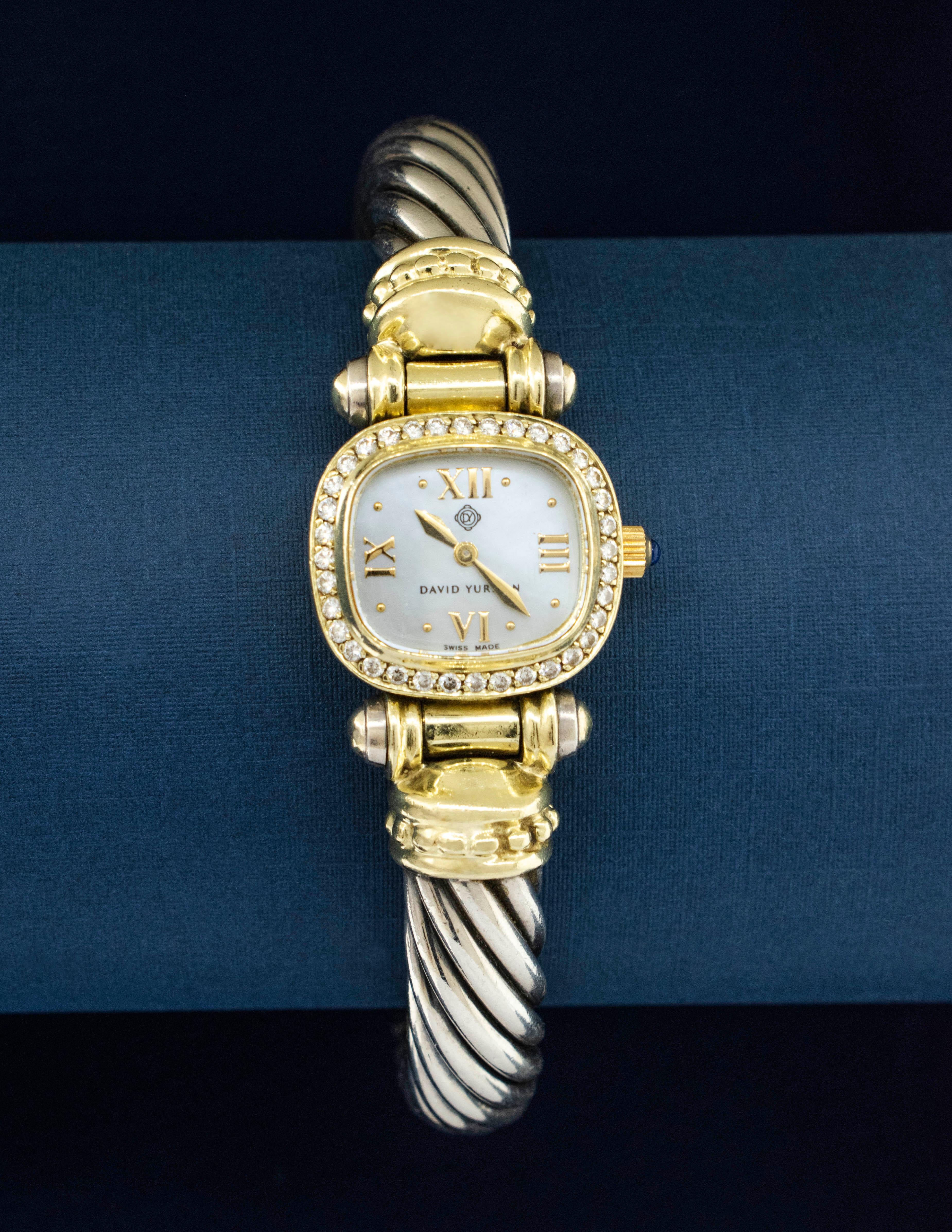 Montre David Yurman en or jaune 14 carats et argent sterling, ornée de diamants. Cet élégant garde-temps est doté d'un boîtier en or jaune 14 carats avec 36 diamants pour un poids total de 0,47 carat. La pureté du diamant est SI1 et sa couleur G-H.