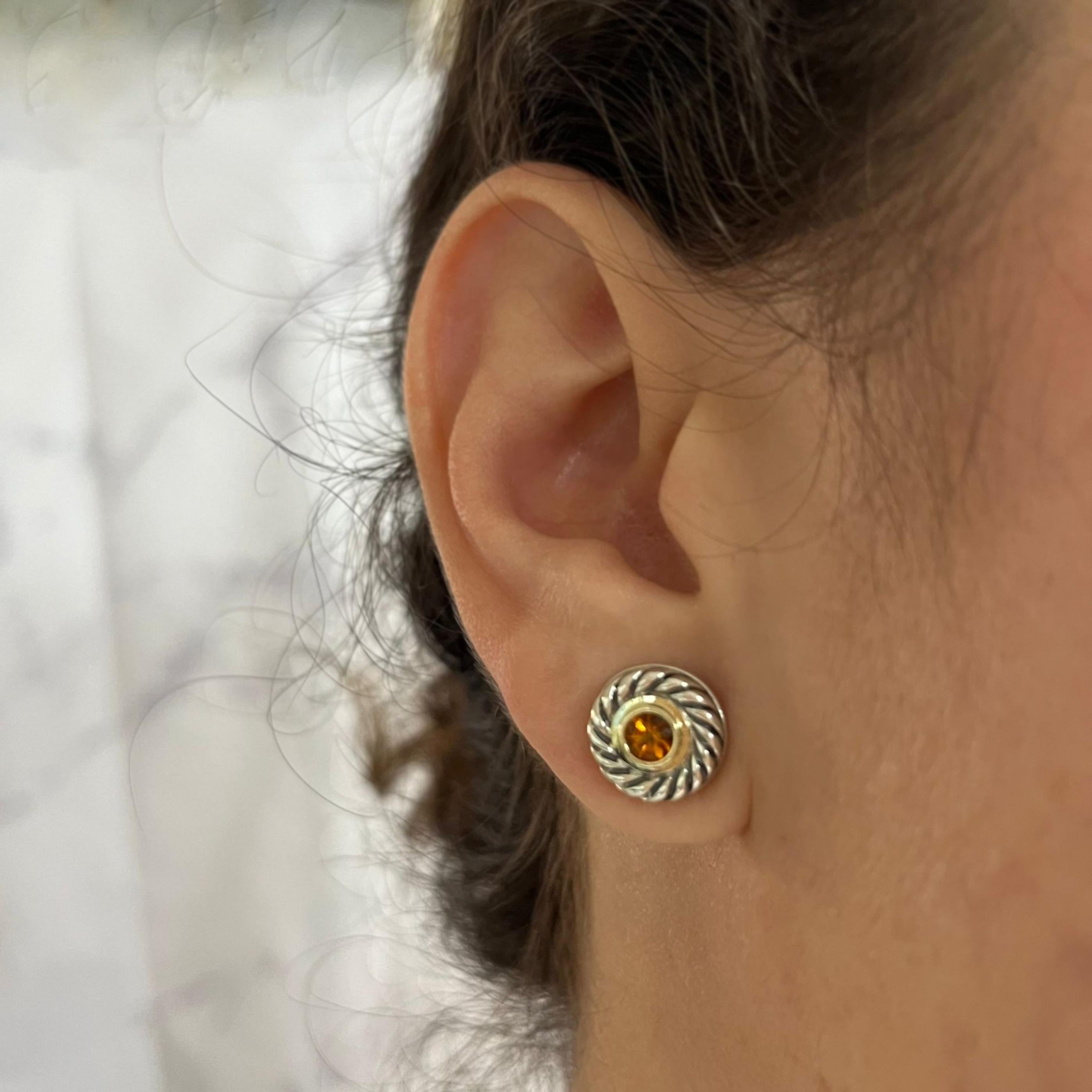 David Yurman sterling silver stud earrings featuring 2 round citrines set in a 14 karat yellow gold bezel. Pierced post with large friction back.