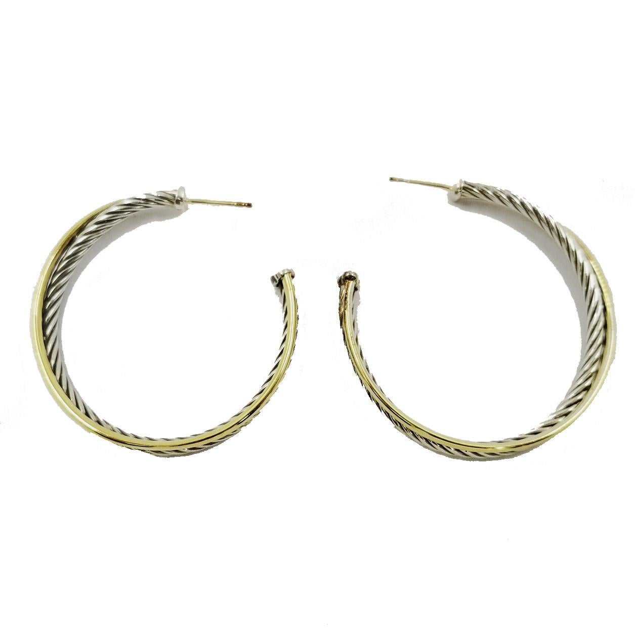 Sterling silver and 18 karat yellow gold crossover hoops by designer David Yurman. The large hoop earrings have a 44mm diameter with gold post and large sterling silver friction back. $975 original MSRP. Comes with new David Yurman polishing cloth.