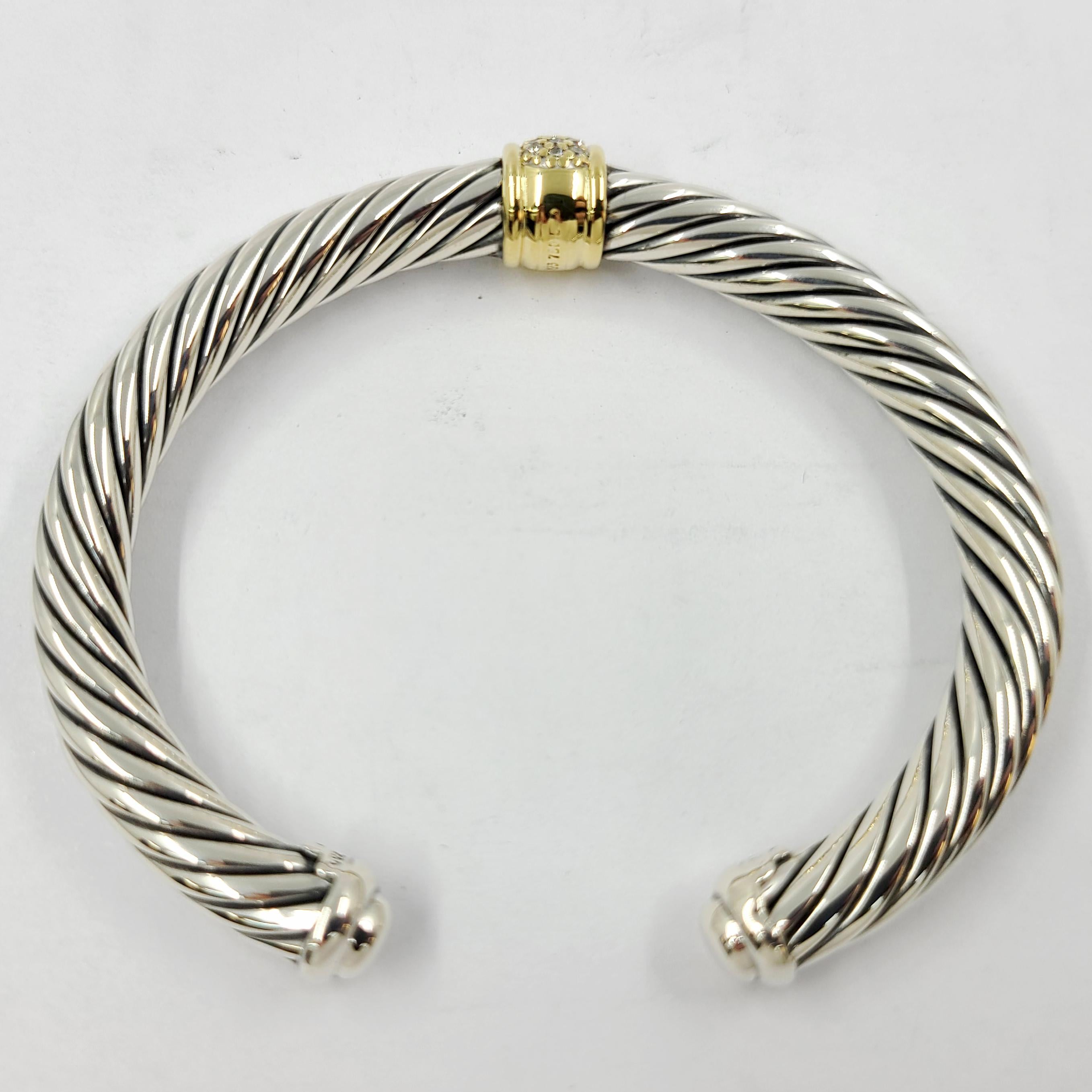 David Yurman Sterling Silver & 18 Karat Yellow Gold Wide Cable Cuff Bracelet Featuring 25 Round Diamonds Totaling Approximately 0.21 Carats. MSRP $1,700. Includes David Yurman Travel Pouch.